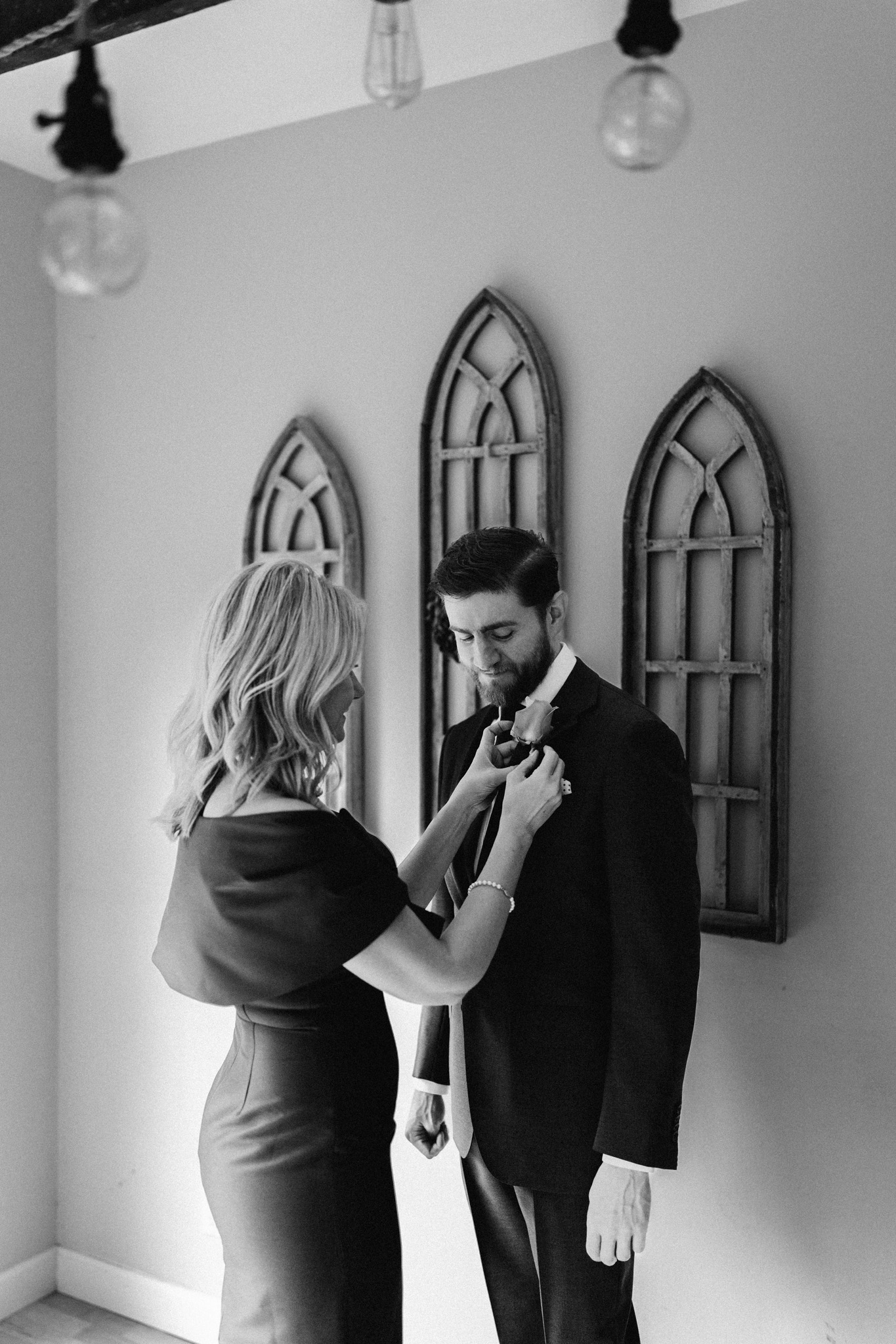 Groom getting ready photos with family