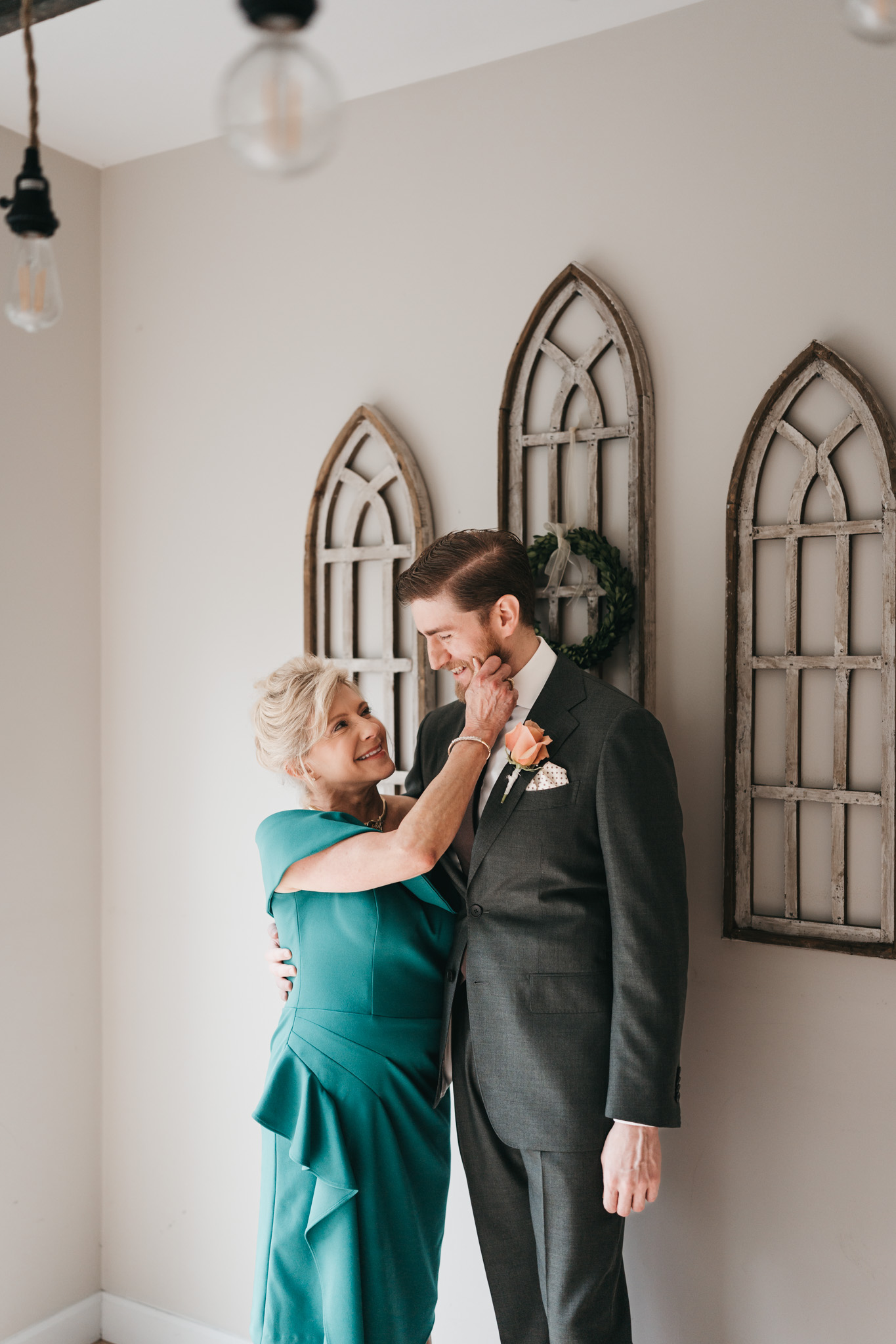 Groom getting ready photos with family