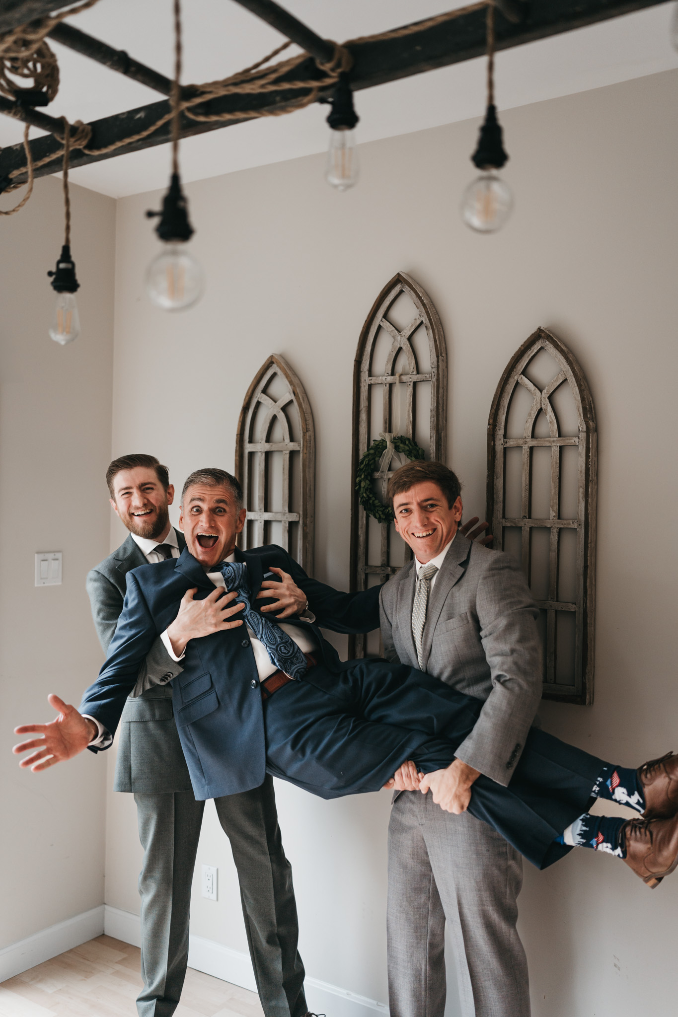 Groom getting ready photos with family