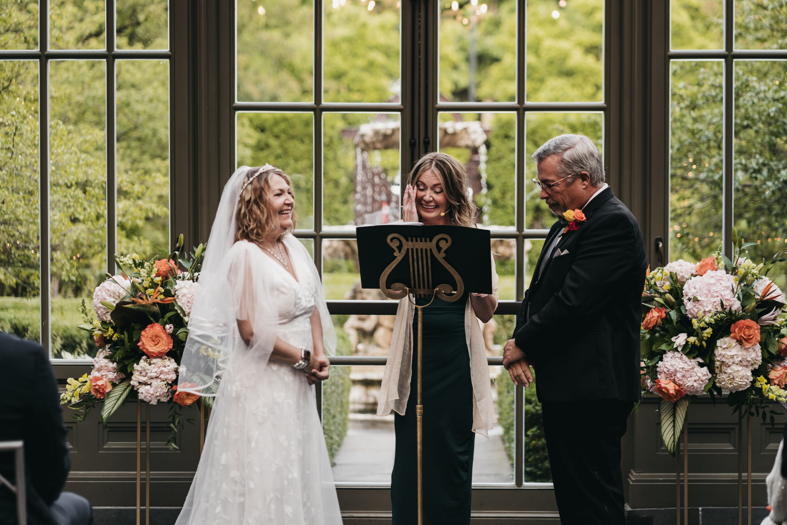 Intimate ceremony in the glass conservatory at the Park Royal Hotel.