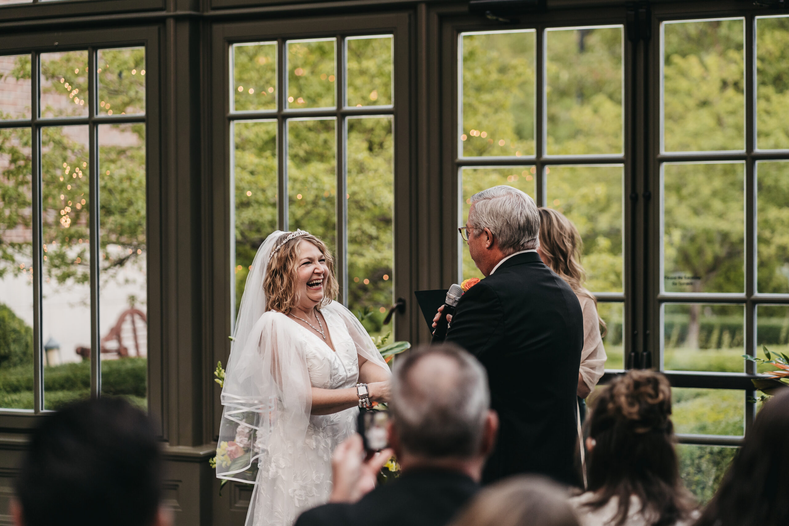 Intimate ceremony in the glass conservatory at the Park Royal Hotel.