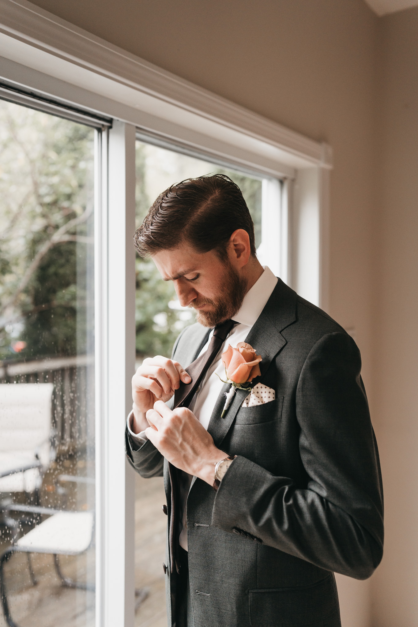 Groom getting ready photos with family