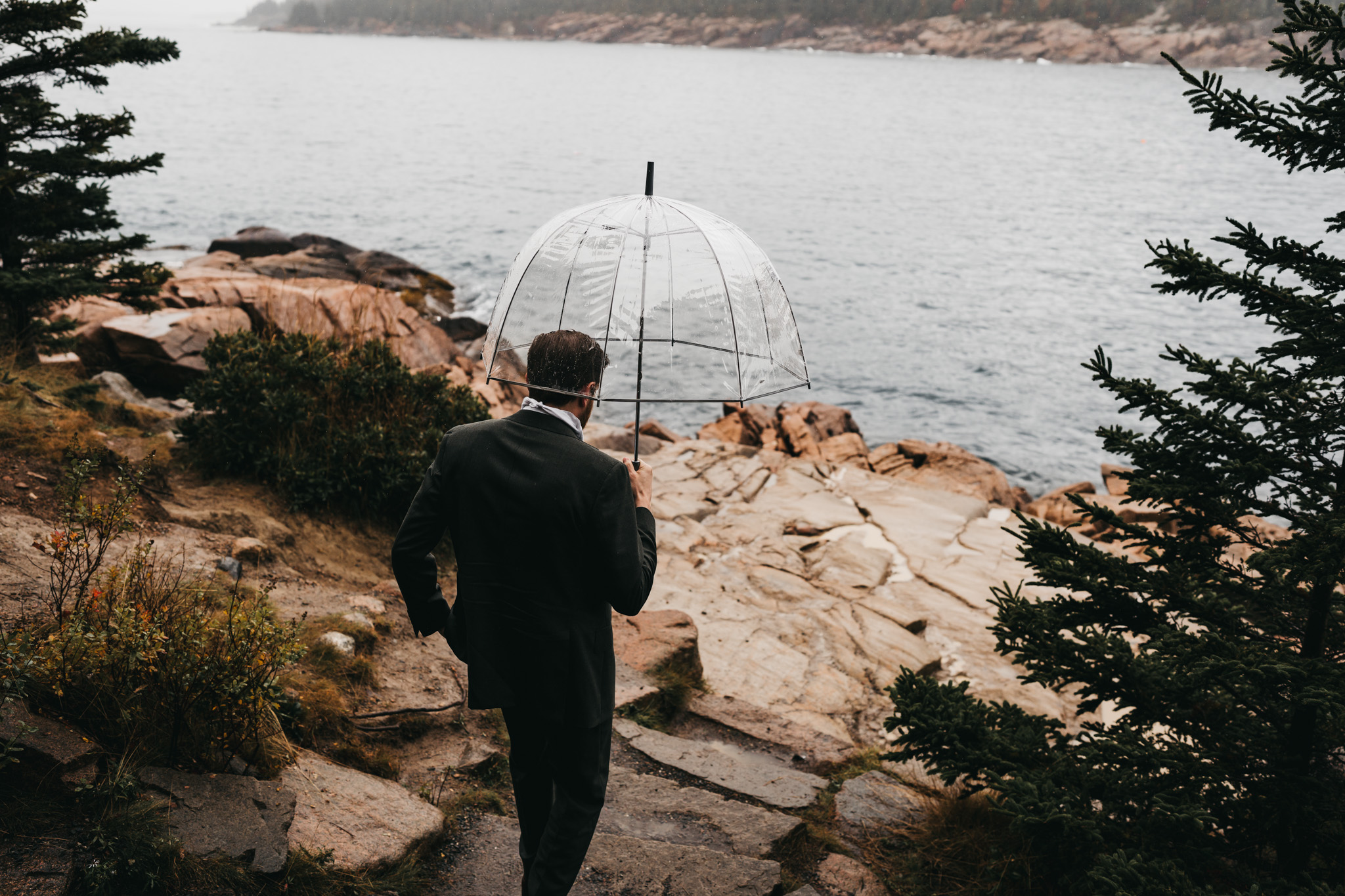 Bride and groom first look at Otter Point in Acadia National Park on a moody fall day