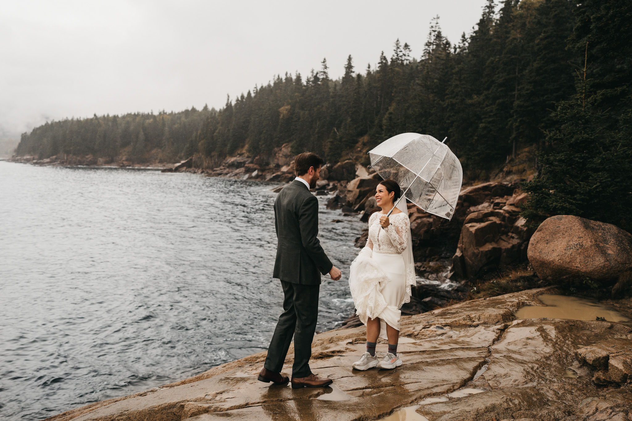 Bride and groom first look at Otter Point in Acadia National Park on a moody fall day