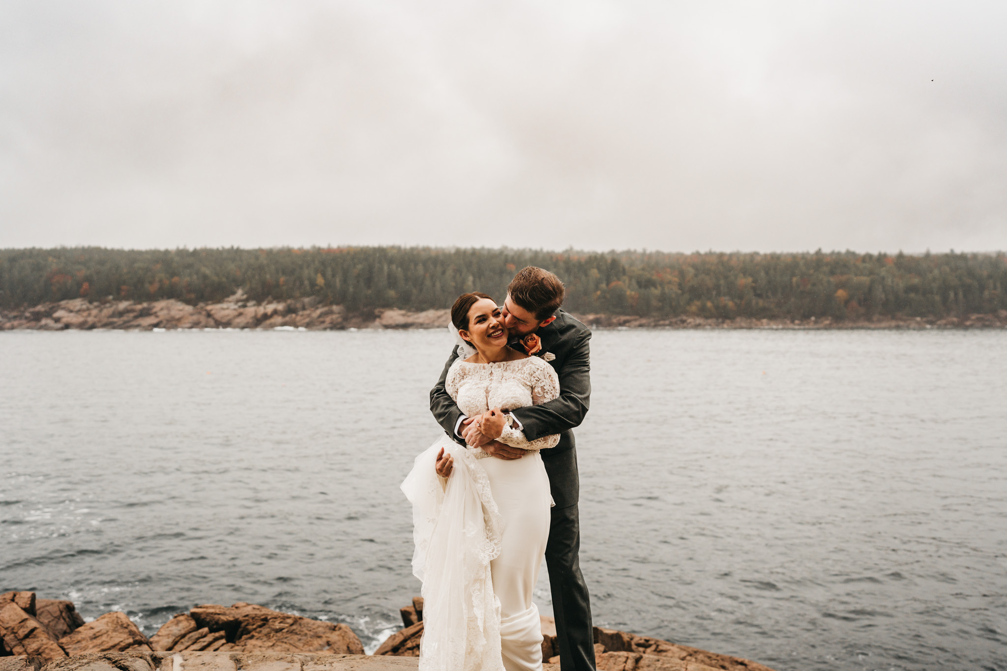 Bride and groom first look at Otter Point in Acadia National Park on a moody fall day
