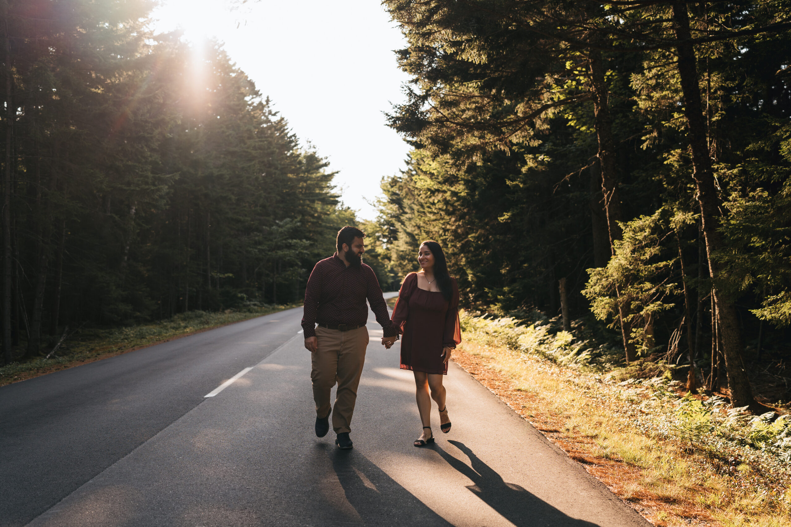 Couple walking down Park Loop road in Acadia