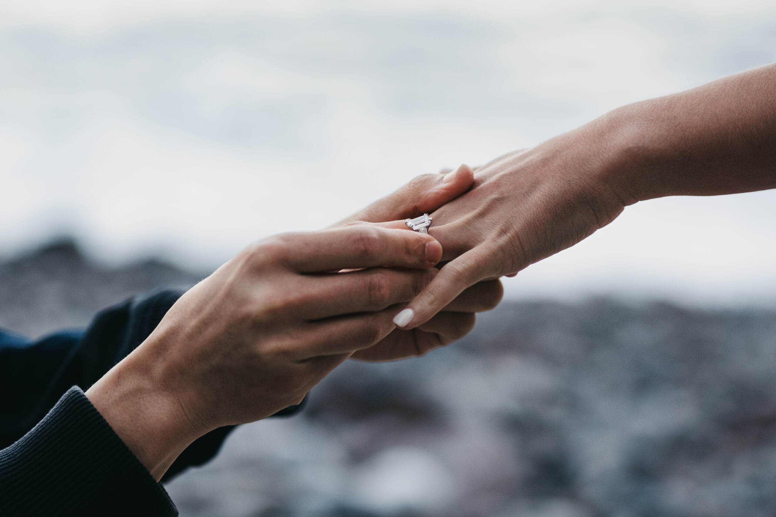 Emerald cut engagement ring during Acadia National Park proposal