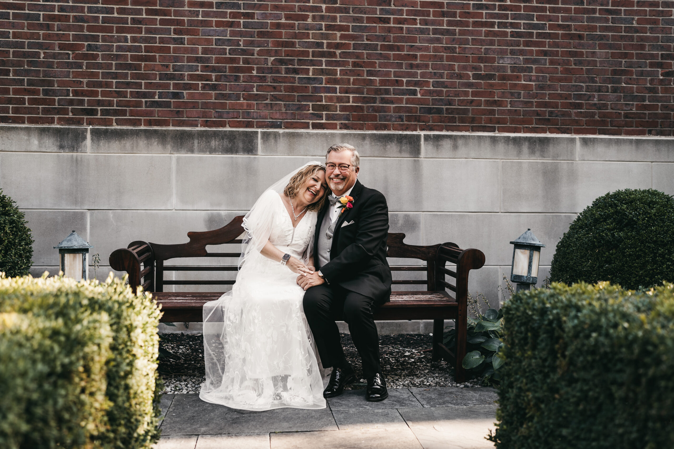 Couple embracing in the garden at their intimate Michigan wedding