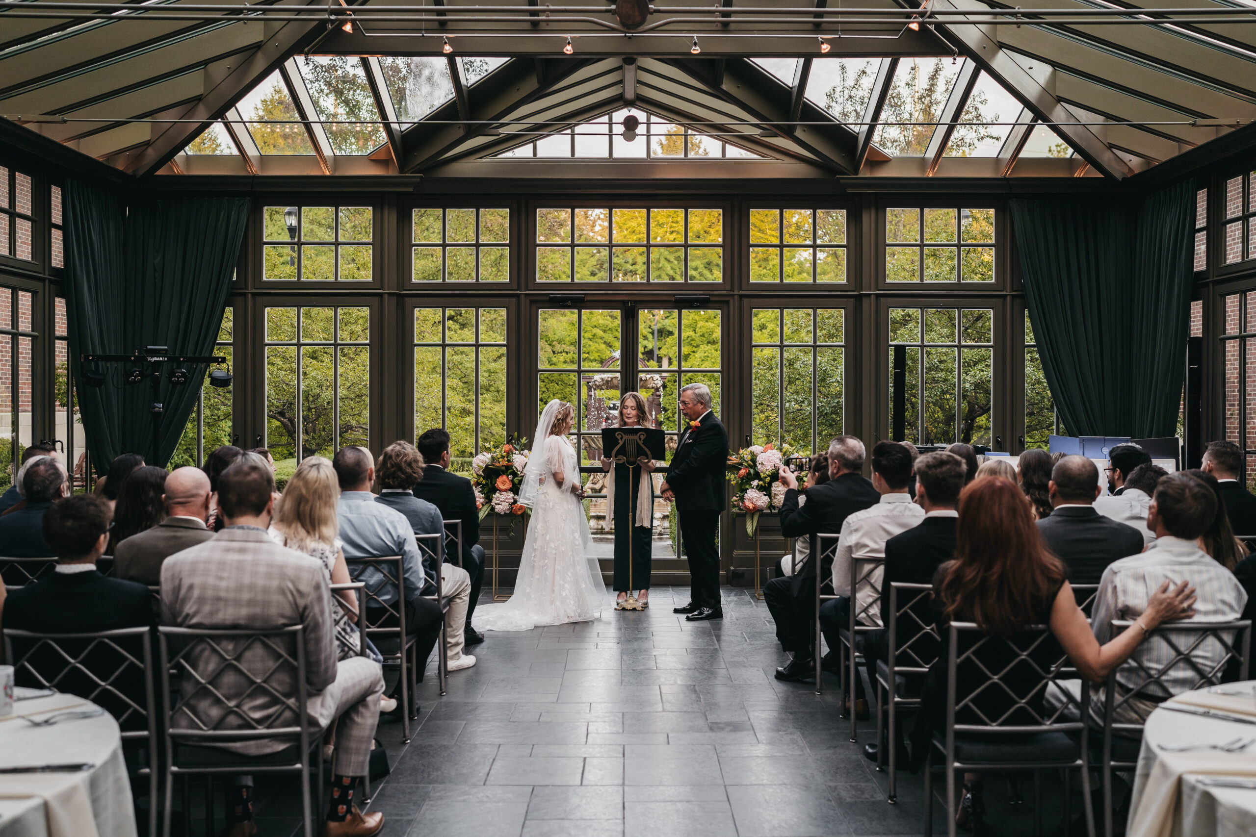 Intimate ceremony in the glass conservatory at the Park Royal Hotel.