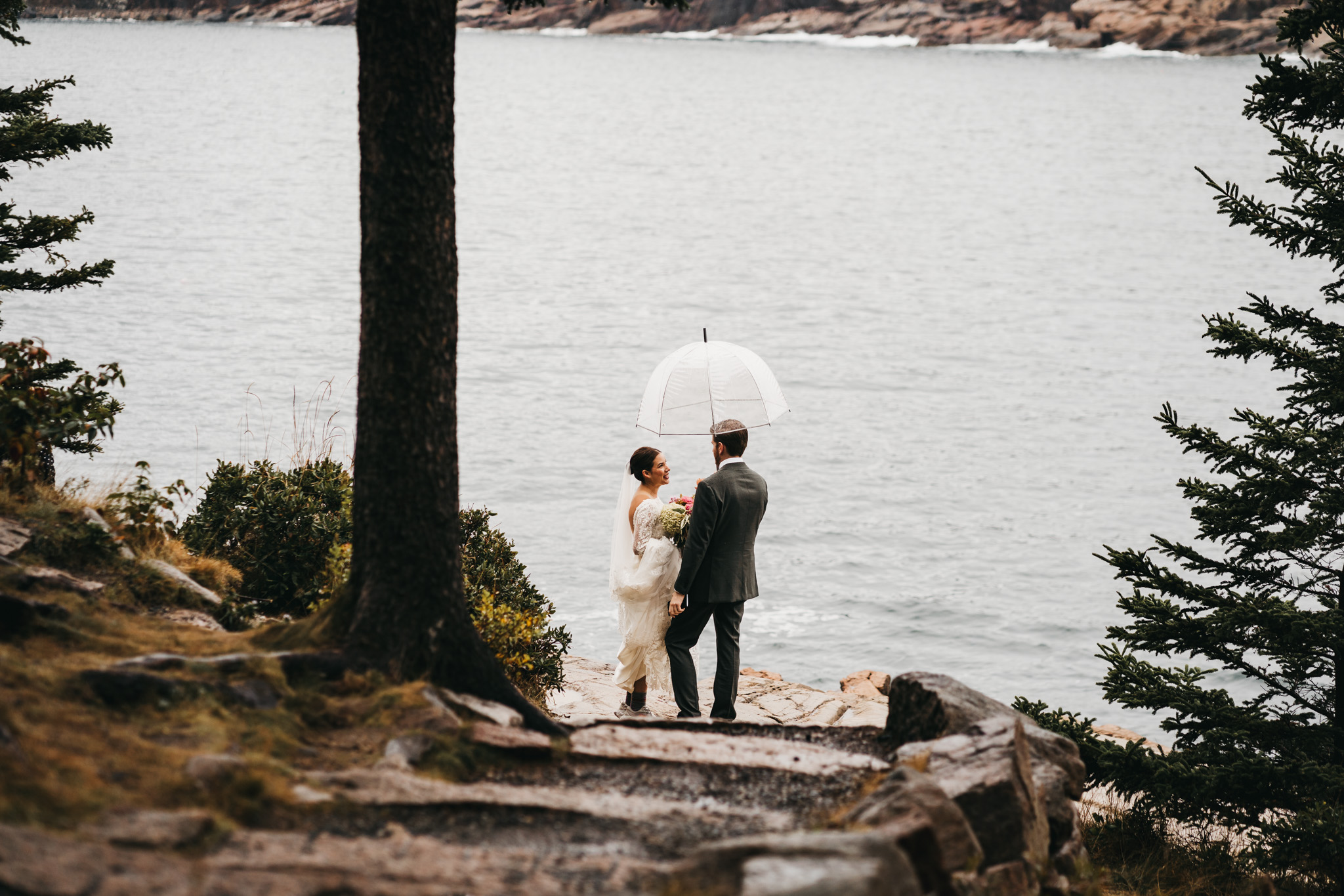 Bride and groom first look at Otter Point in Acadia National Park on a moody fall day