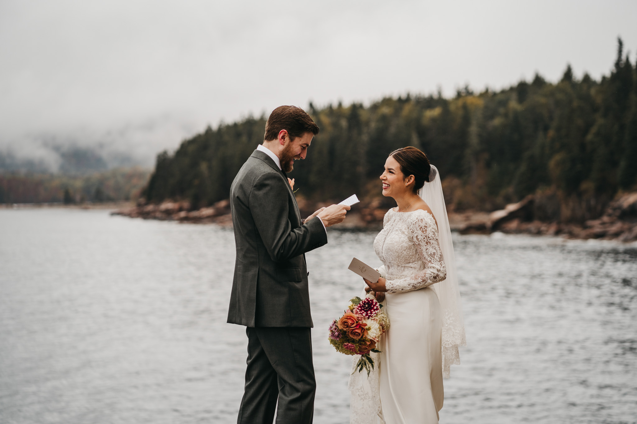 Bride and groom first look at Otter Point in Acadia National Park on a moody fall day