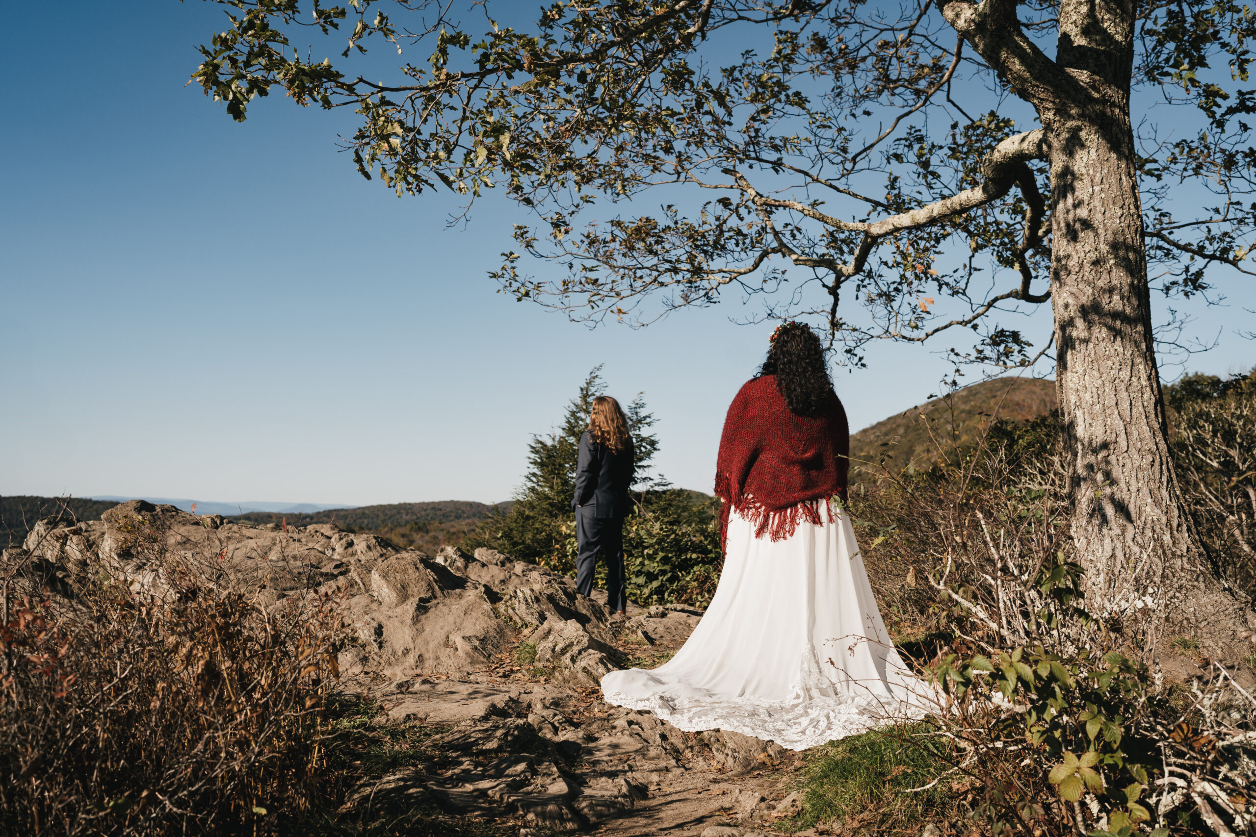 Bride and groom sharing their first look at point overlook