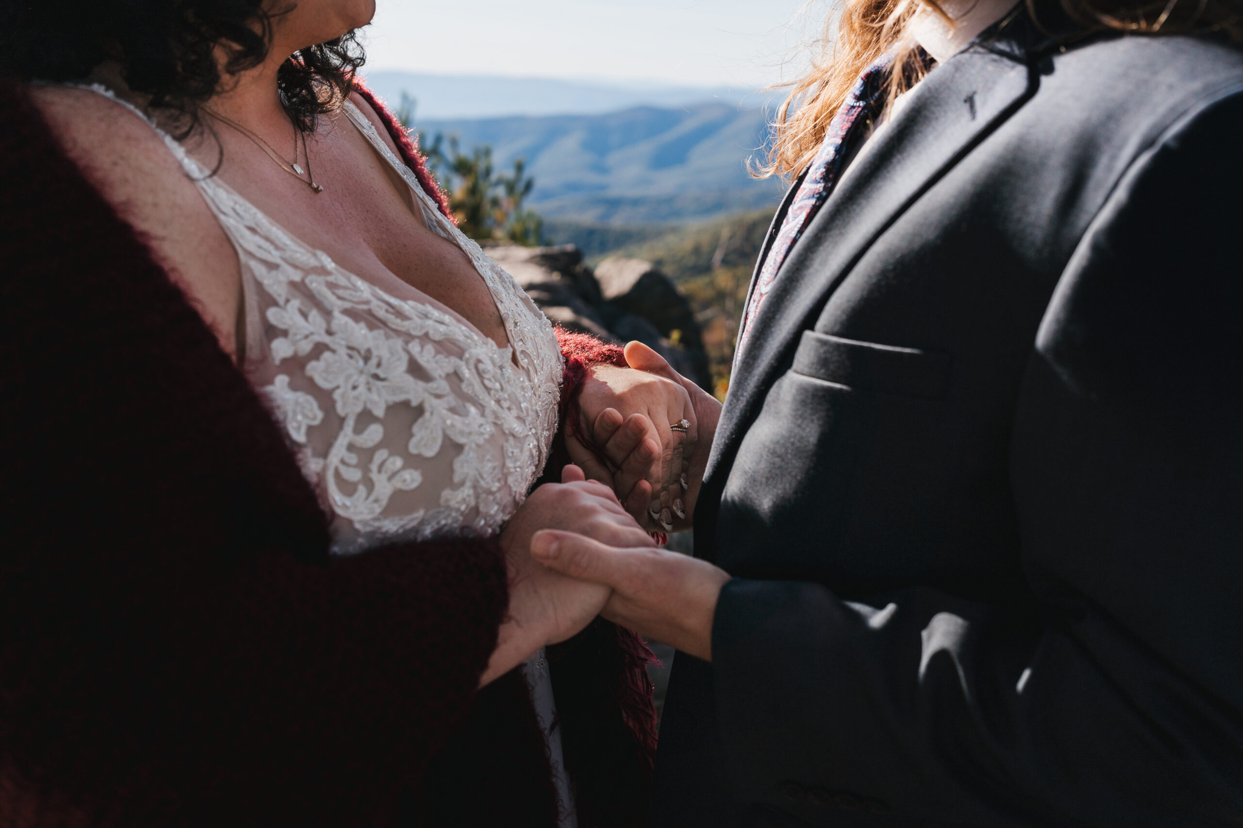 Bride and groom sharing their first look at point overlook