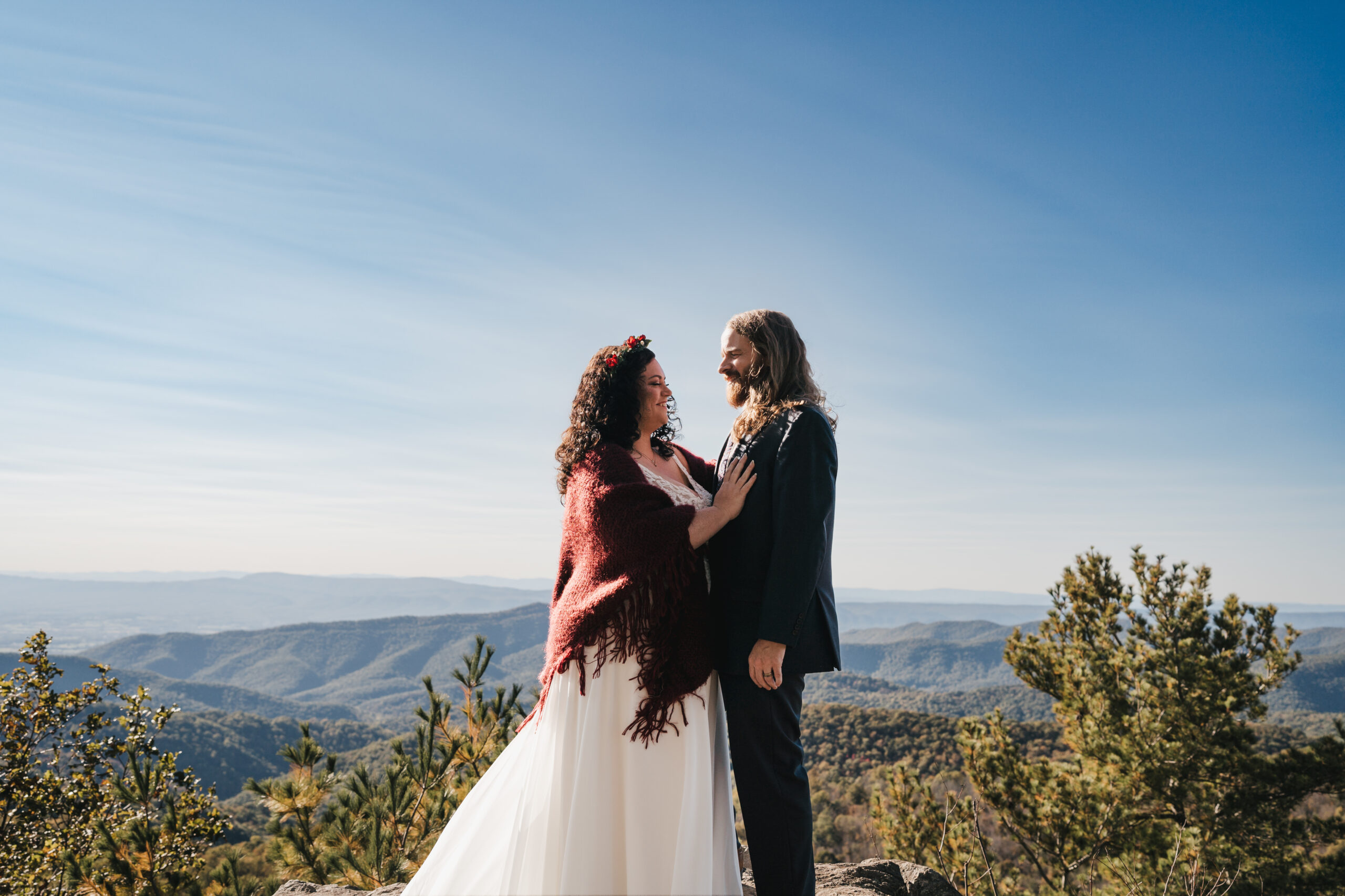 Bride and groom sharing their first look at point overlook
