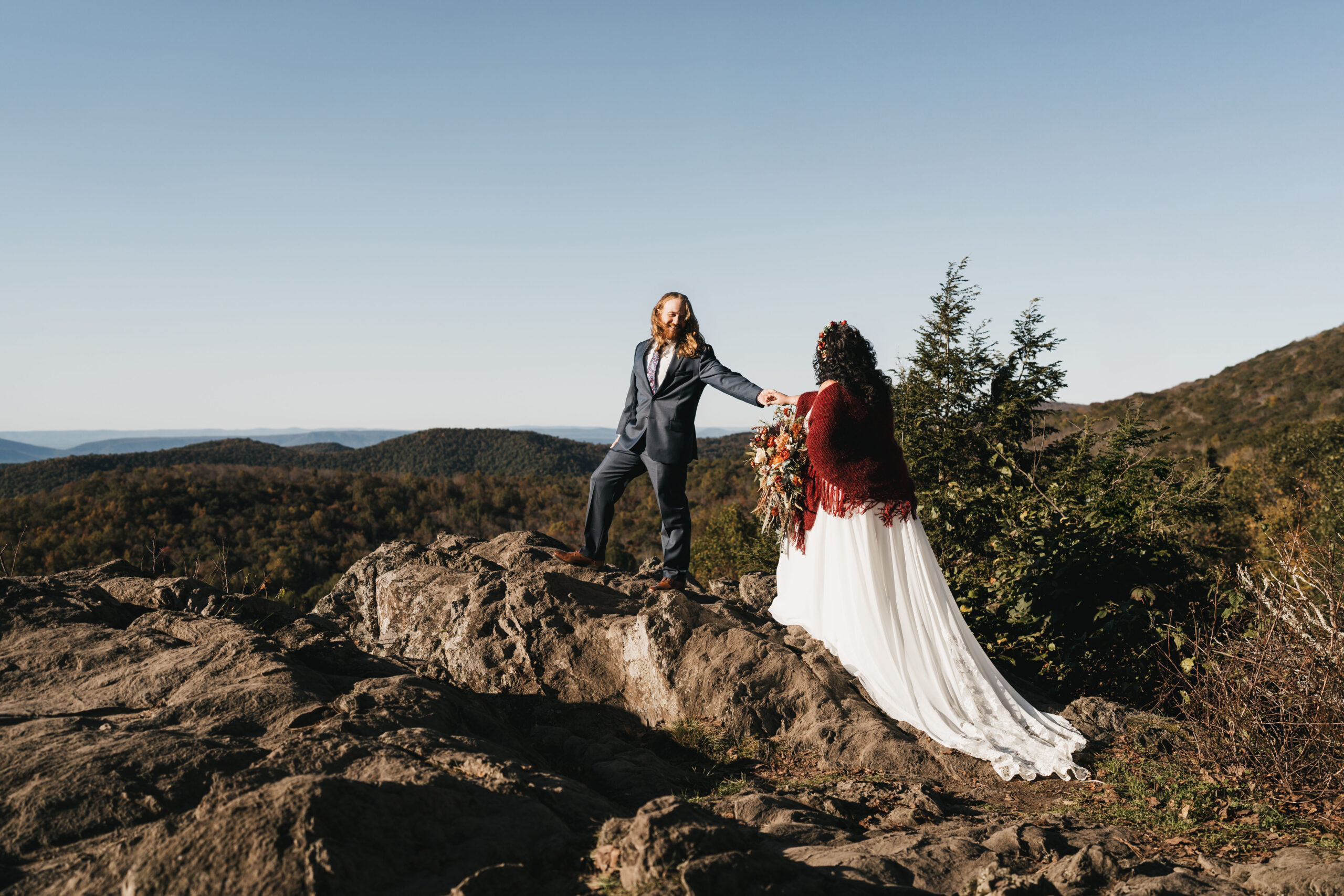 Bride and groom sharing their first look at point overlook