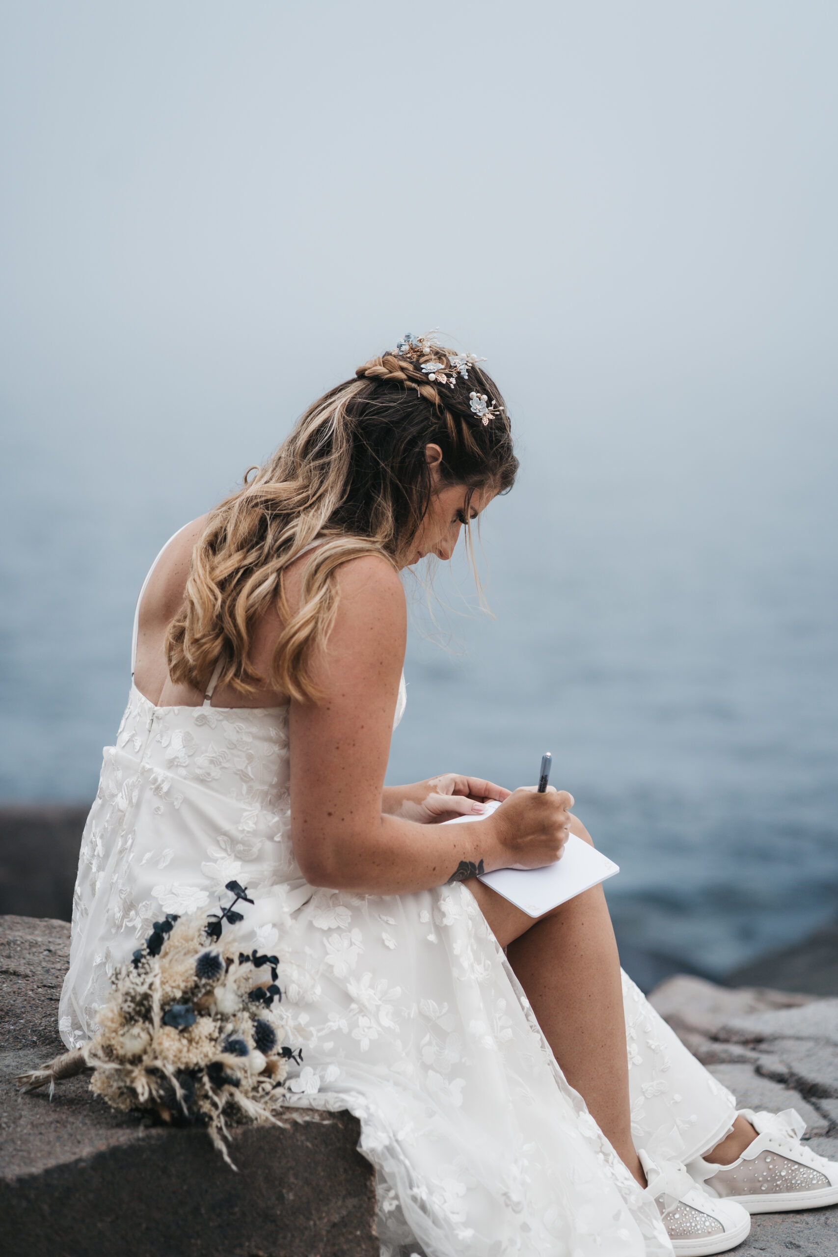 Bride writing her vows during their Maine Coastal elopement.
