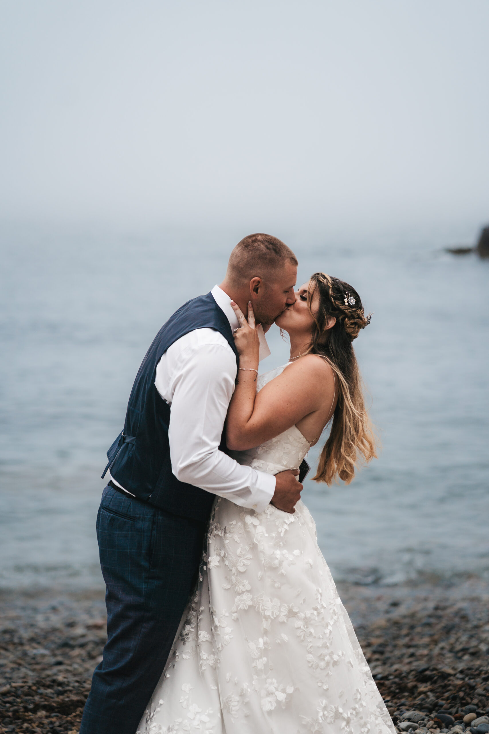 First kiss as husband and wife during their Acadia Maine Coastal elopement.