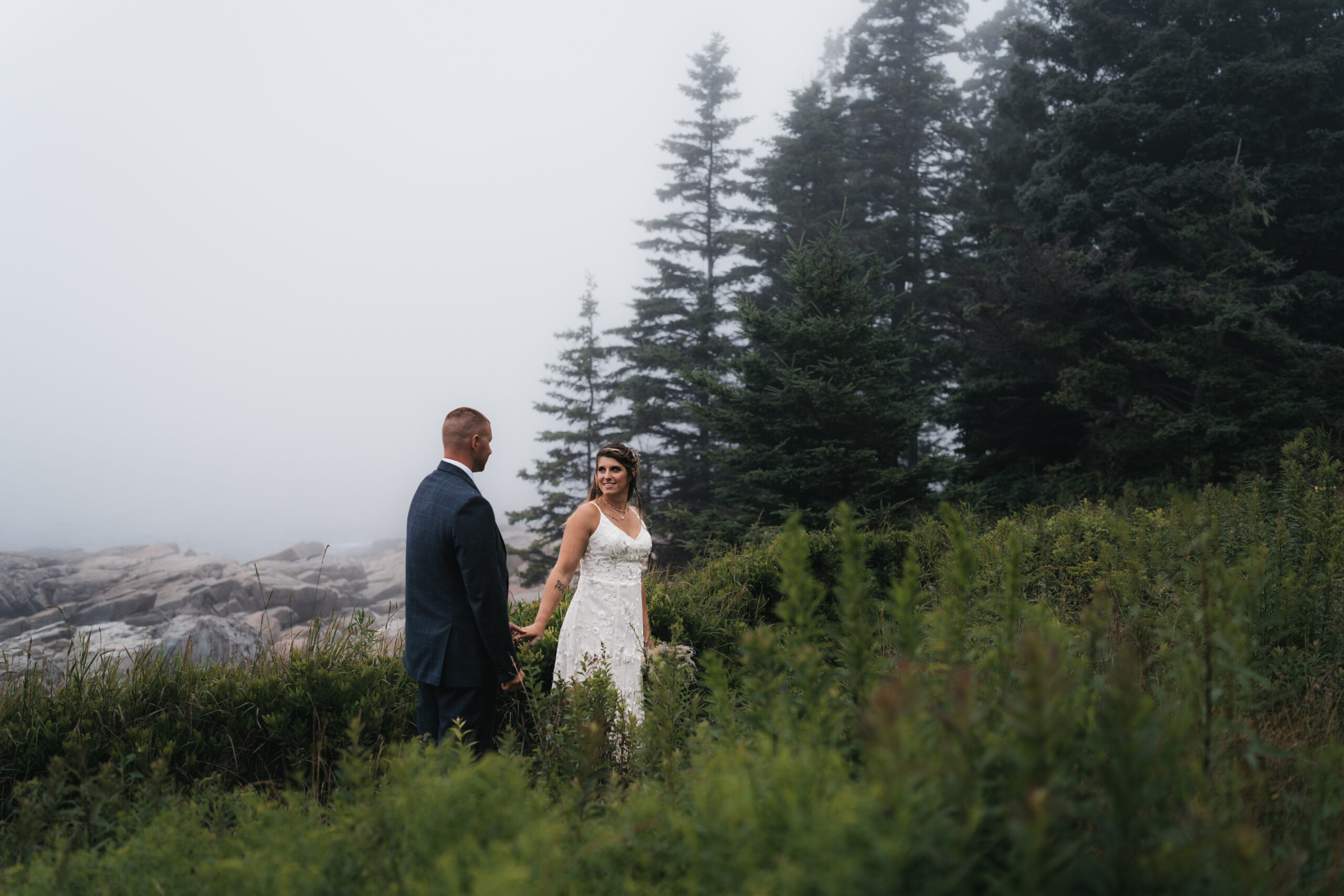 Romantic portrait of couple during a foggy Maine Coastal elopement in Acadia National Park.