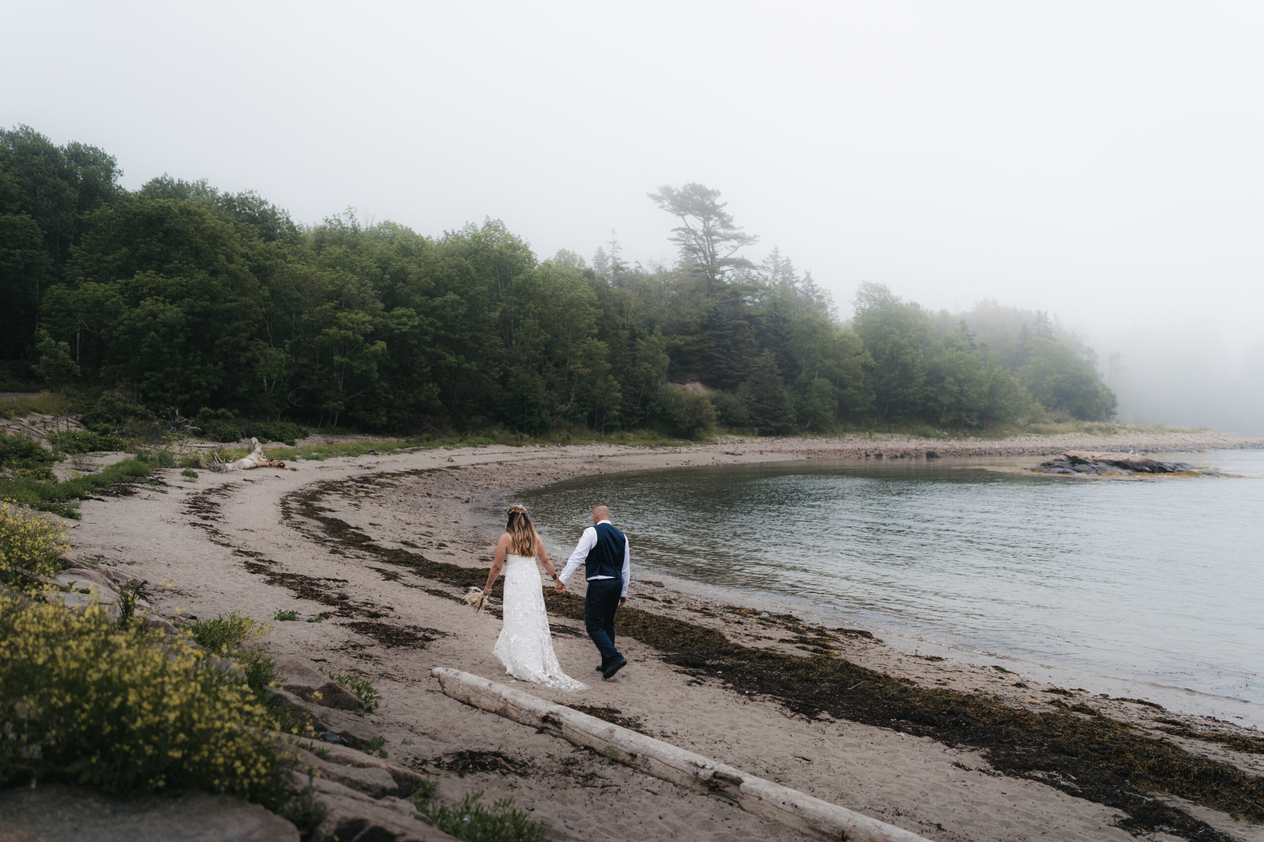 Couple exploring Otter Cove during their dreamy Maine Coastal elopement in Acadia National Park.