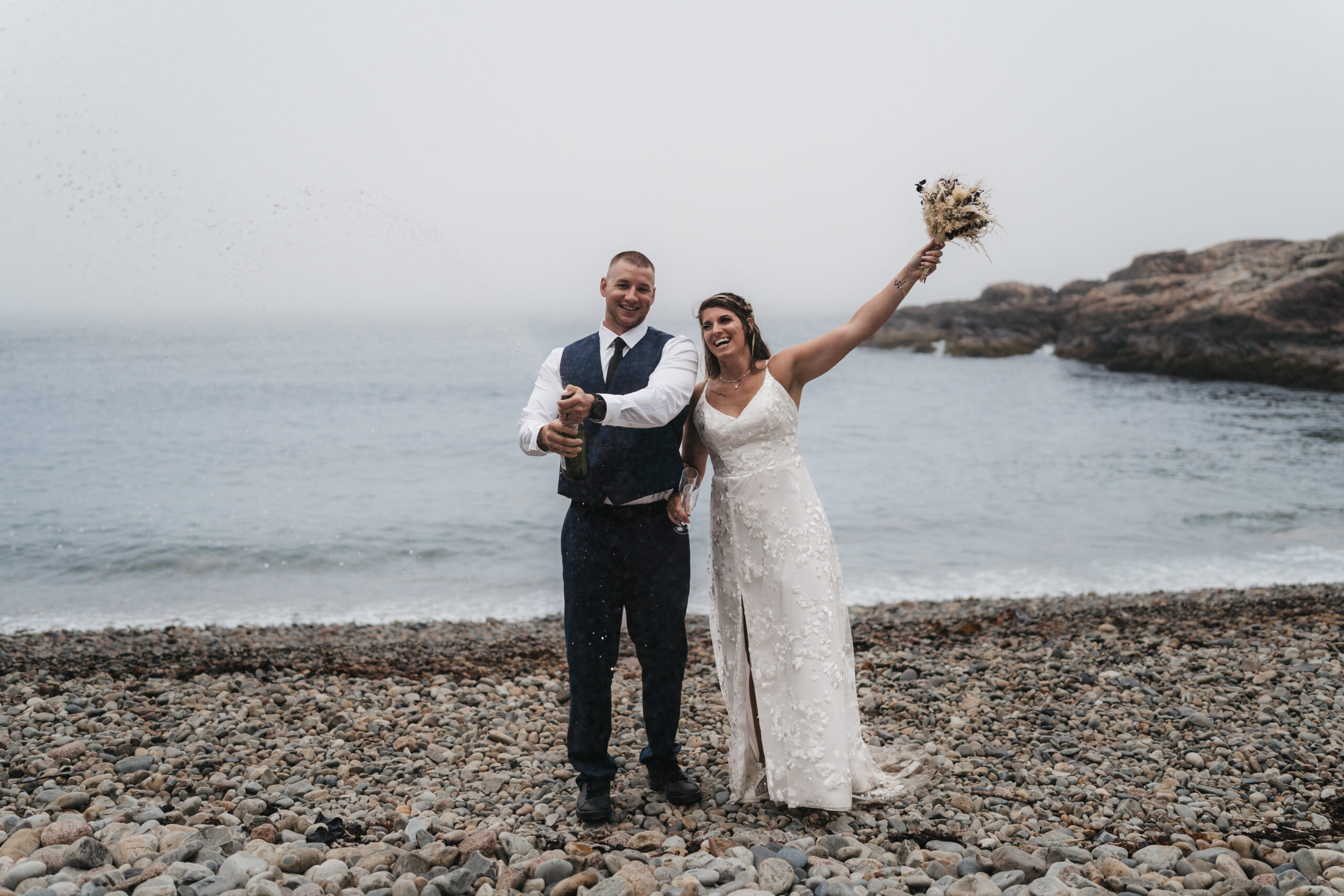 Bride and groom toasting after their Acadia National Park ceremony.