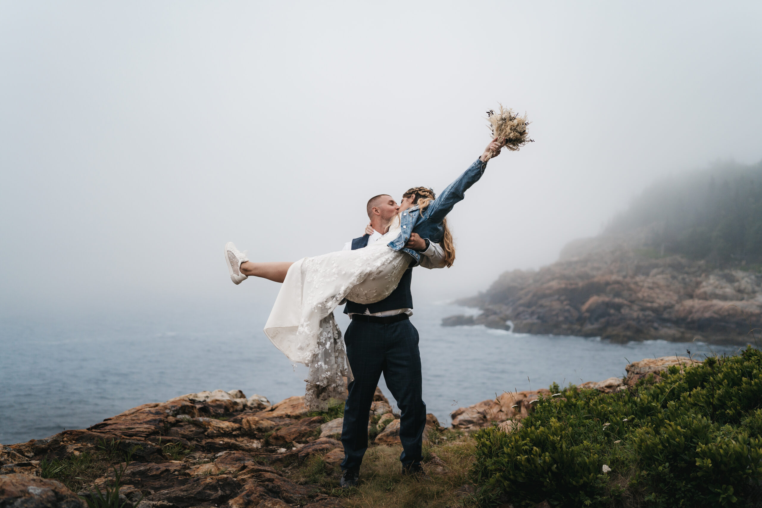Adventurous newlywed portraits along the coast of Little Hunter's Beach.