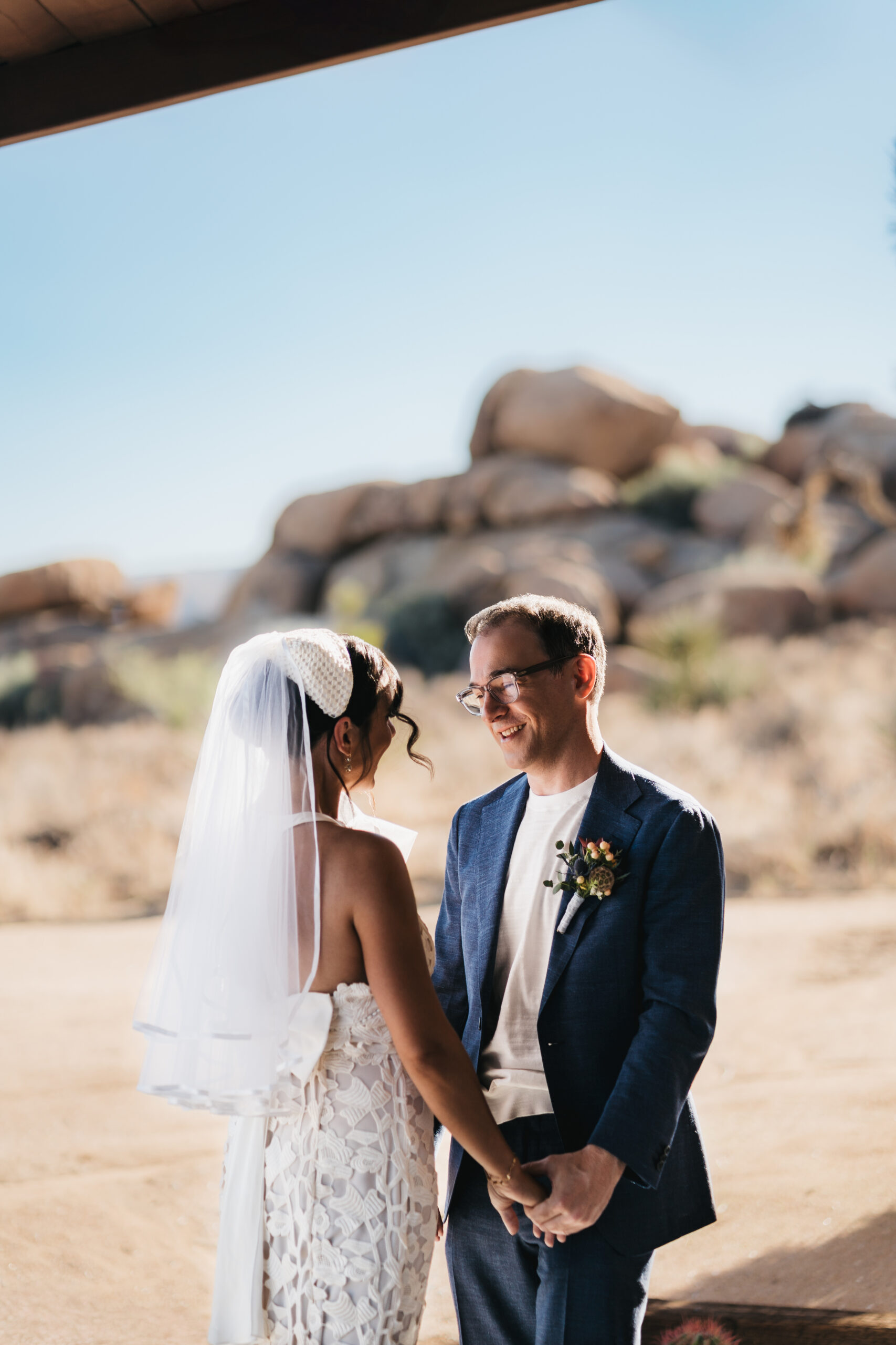 Groom seeing his bride for the first time during their Joshua Tree elopement.