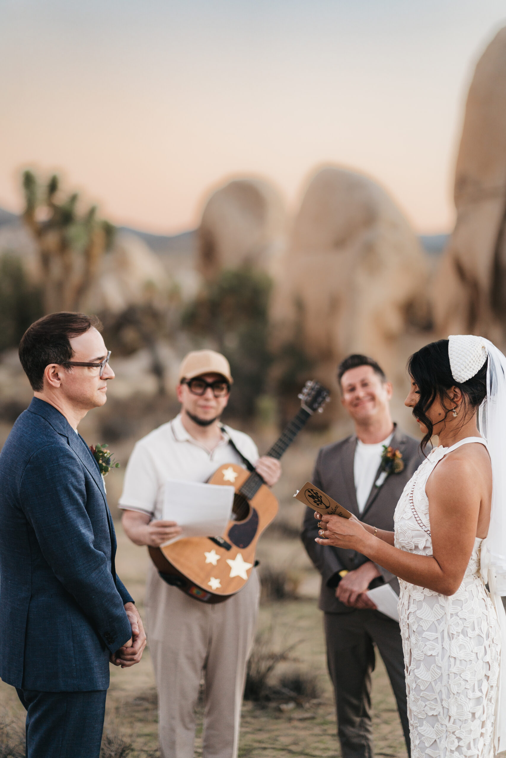 Couple exchanging vows during a romantic Joshua Tree elopement.