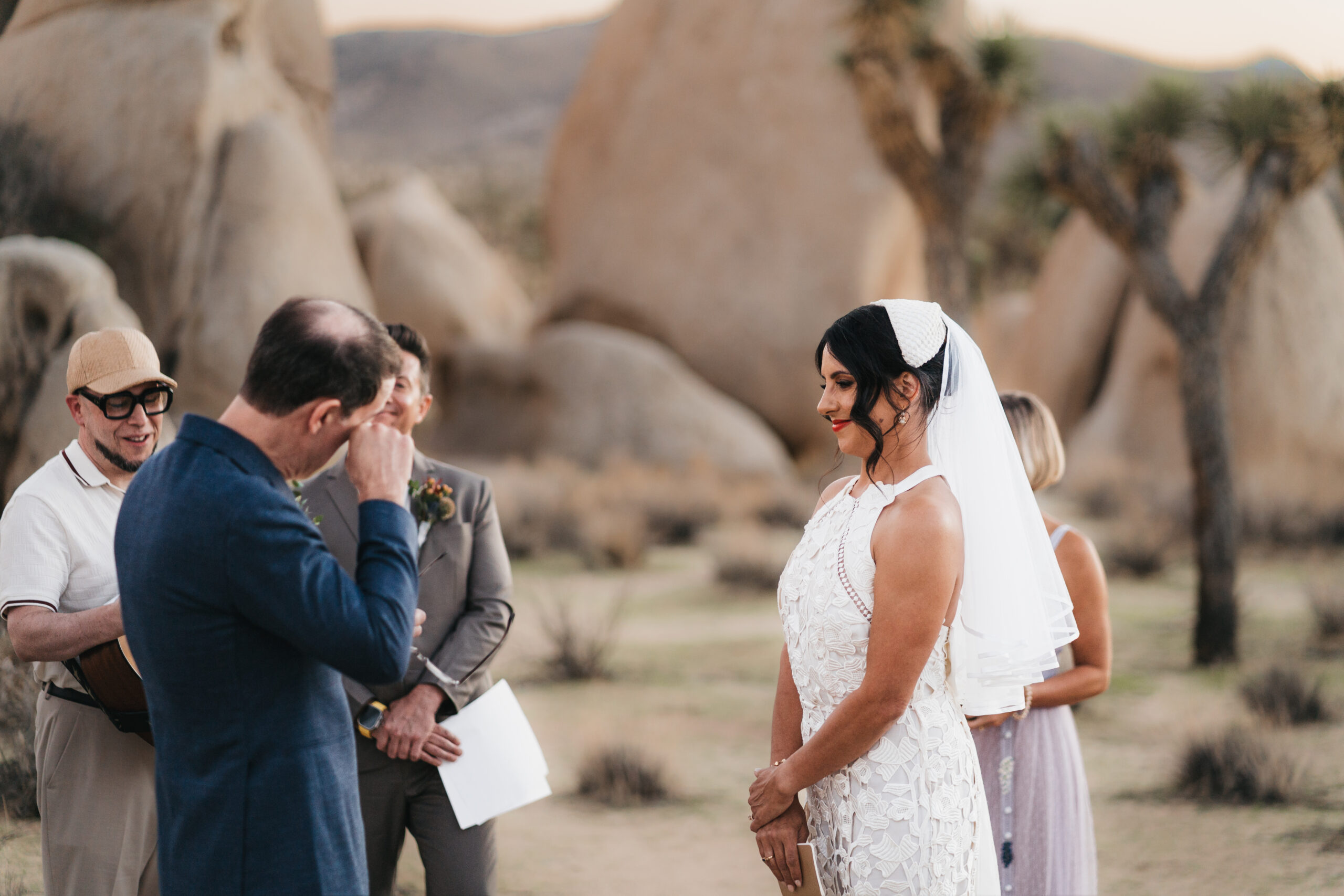 Intimate ceremony during a sunset Joshua Tree elopement.