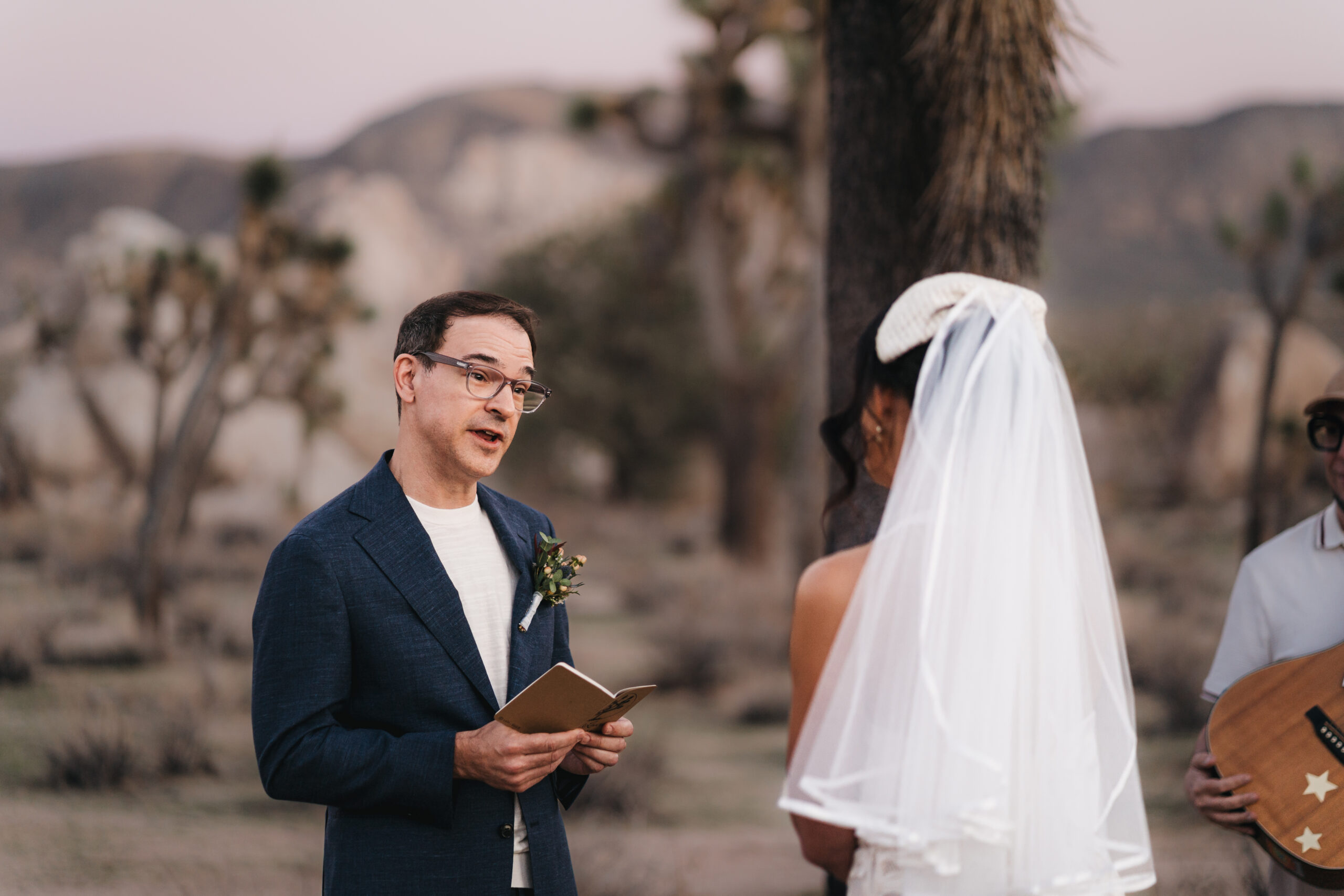 Intimate ceremony during a sunset Joshua Tree elopement.