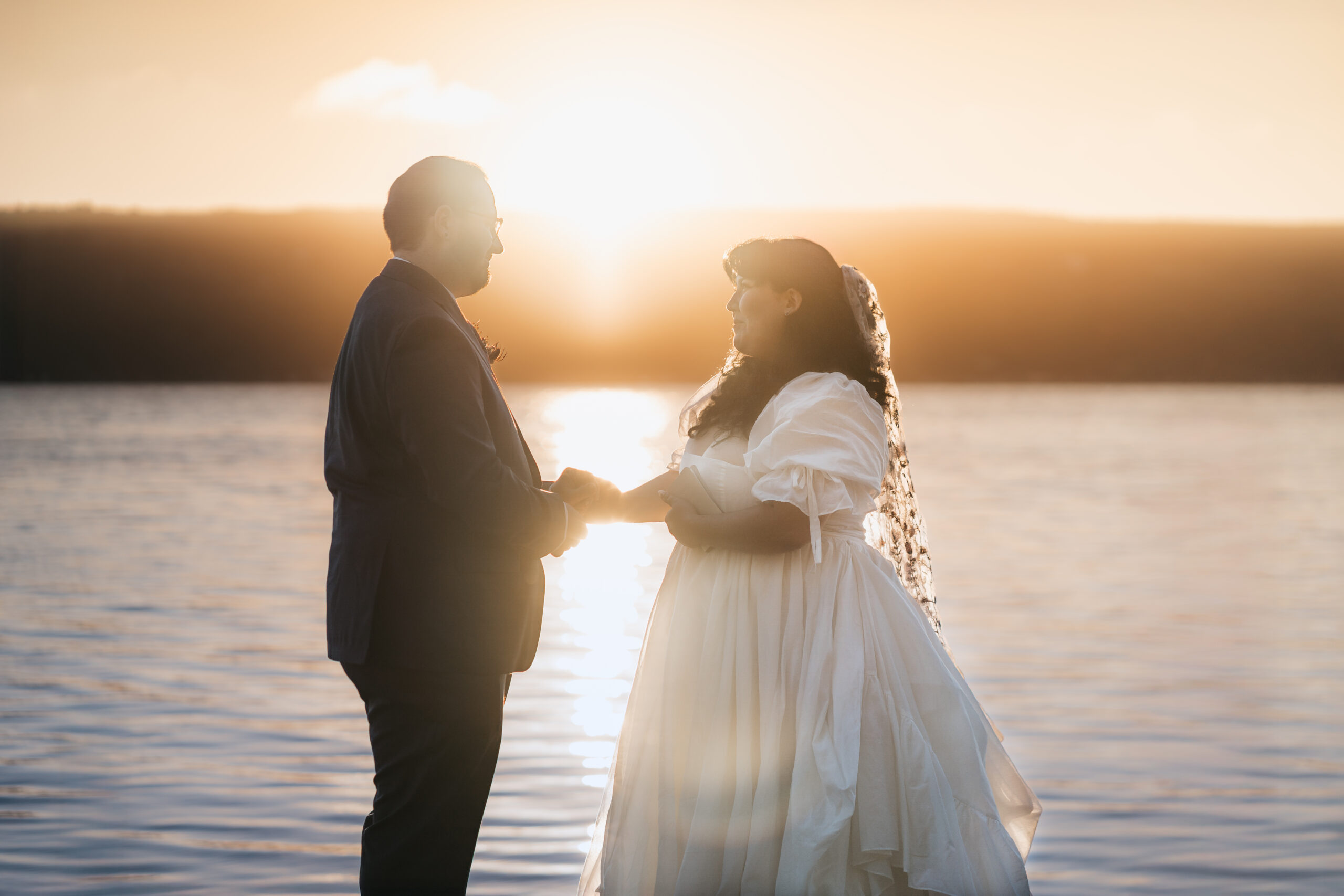 Sunrise ceremony during a magical Watkins Glen elopement on Seneca Lake.