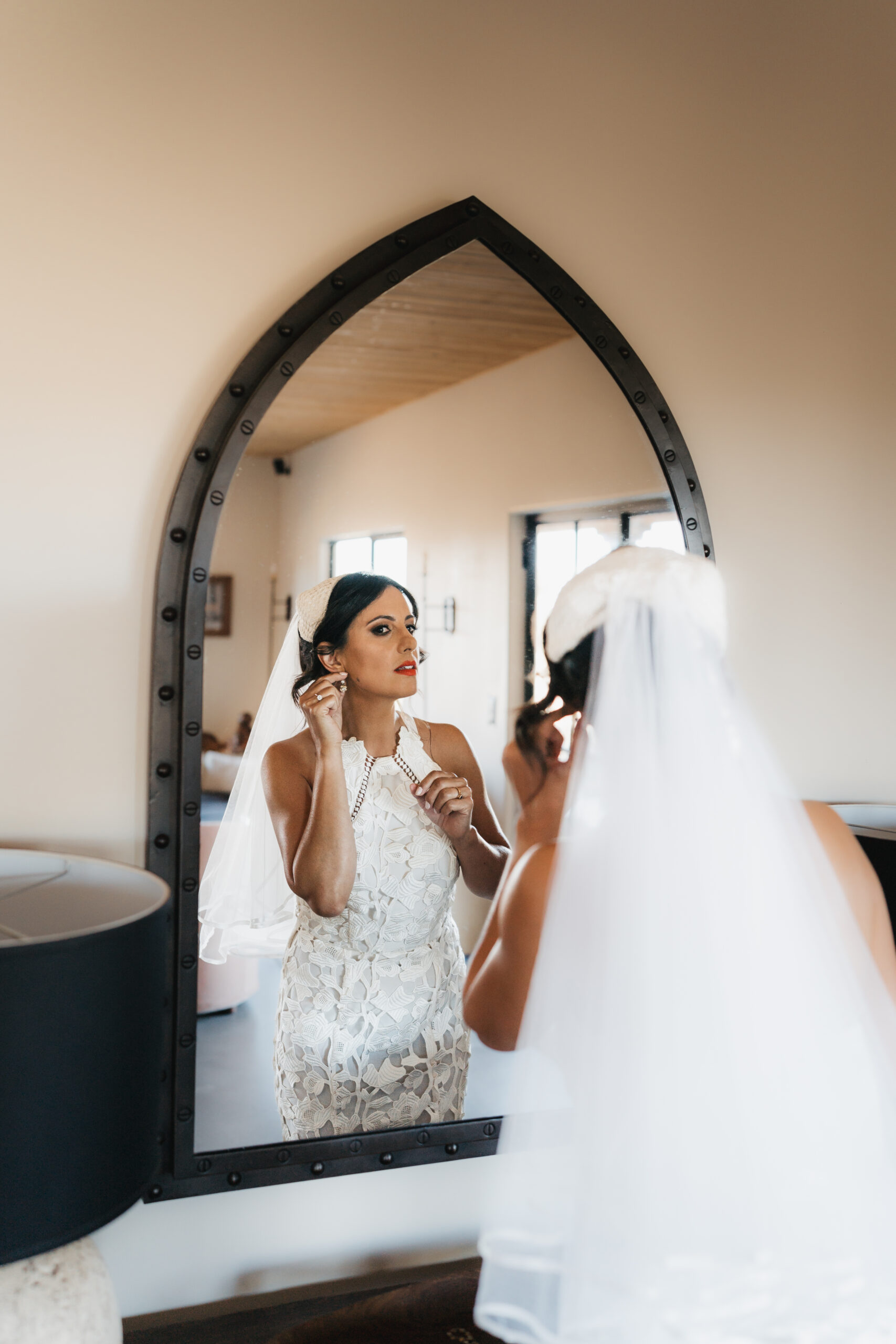 Bride getting ready at a desert Airbnb.