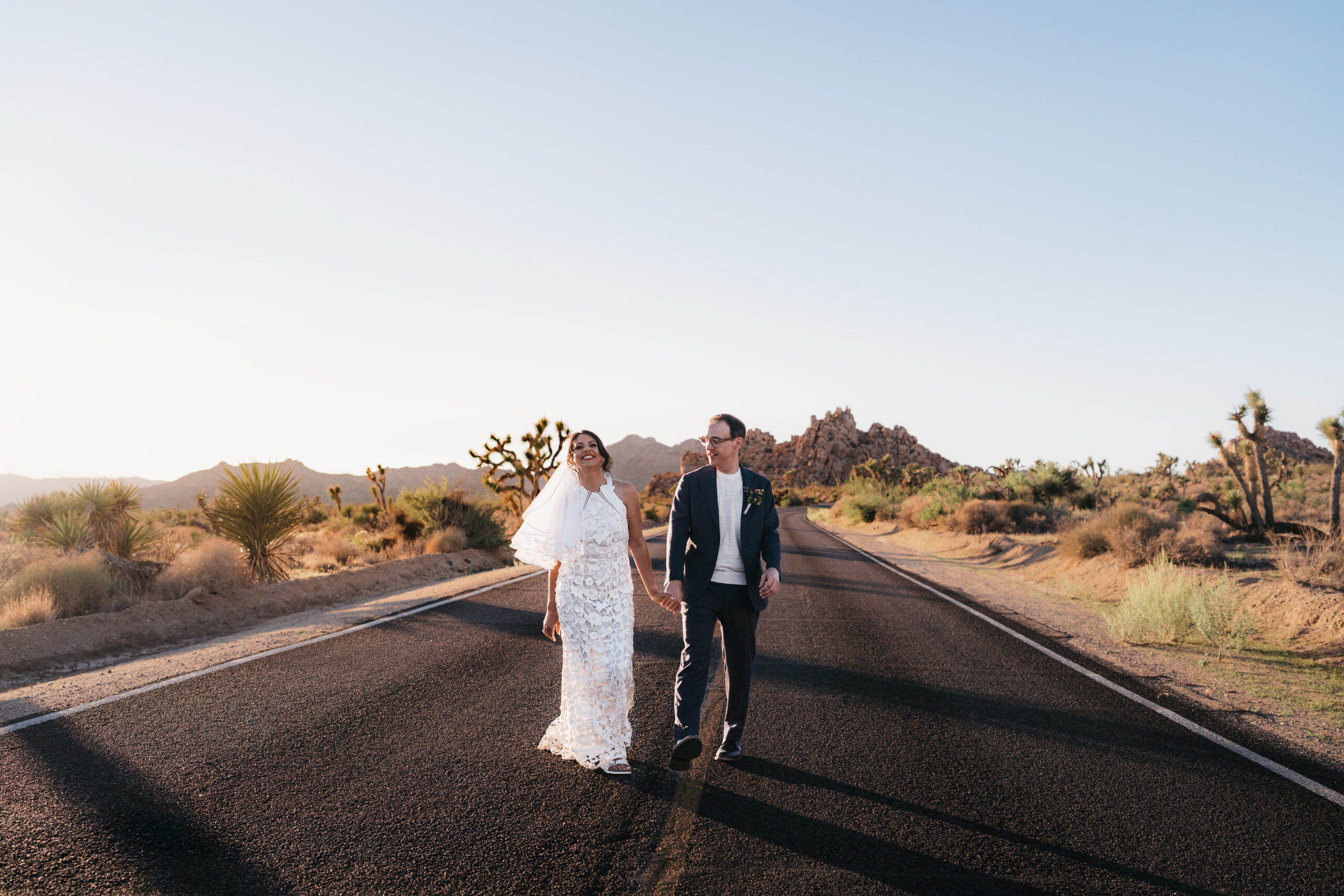 Couple laughing together during their desert Joshua Tree elopement.