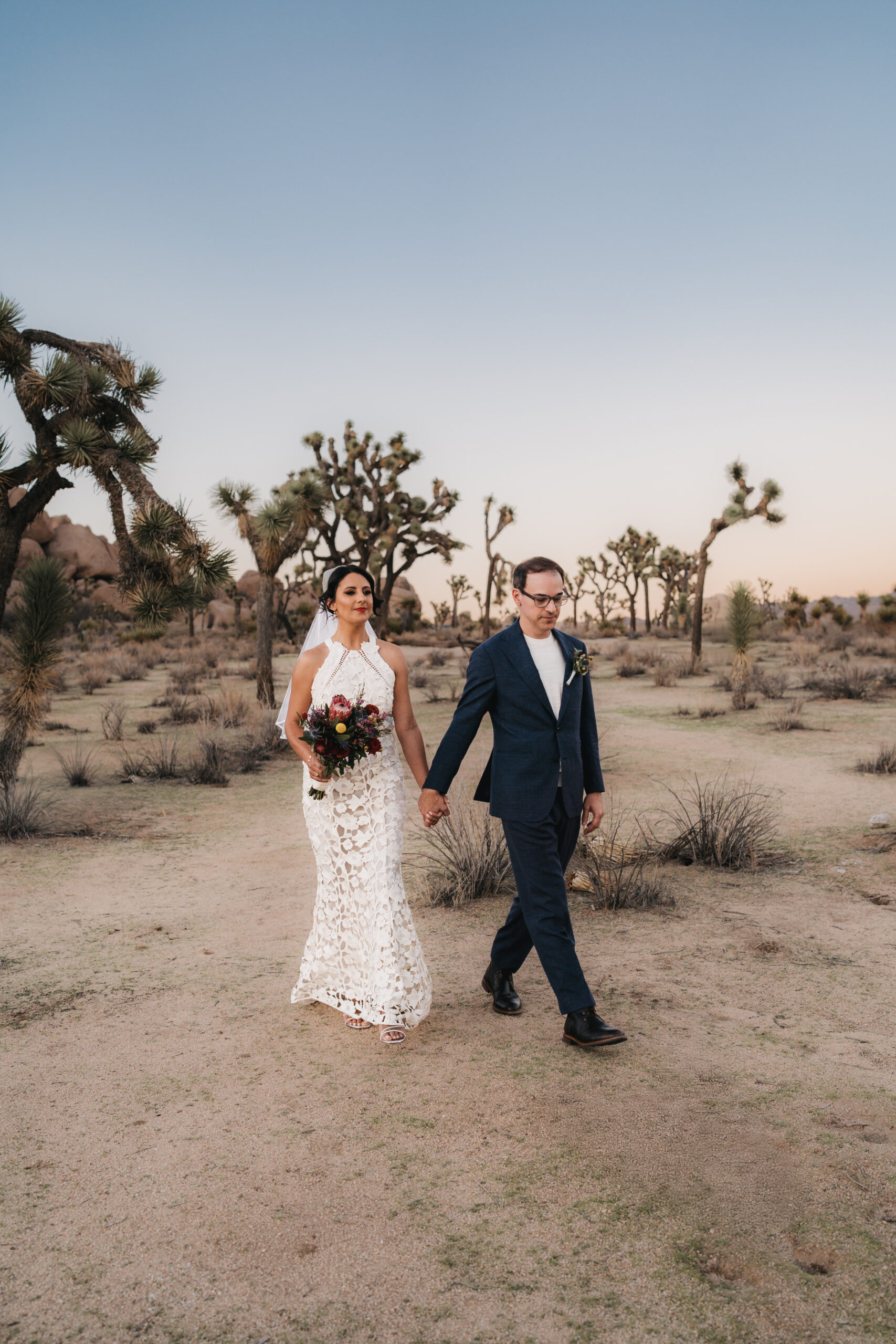 Intimate ceremony during a sunset Joshua Tree elopement.