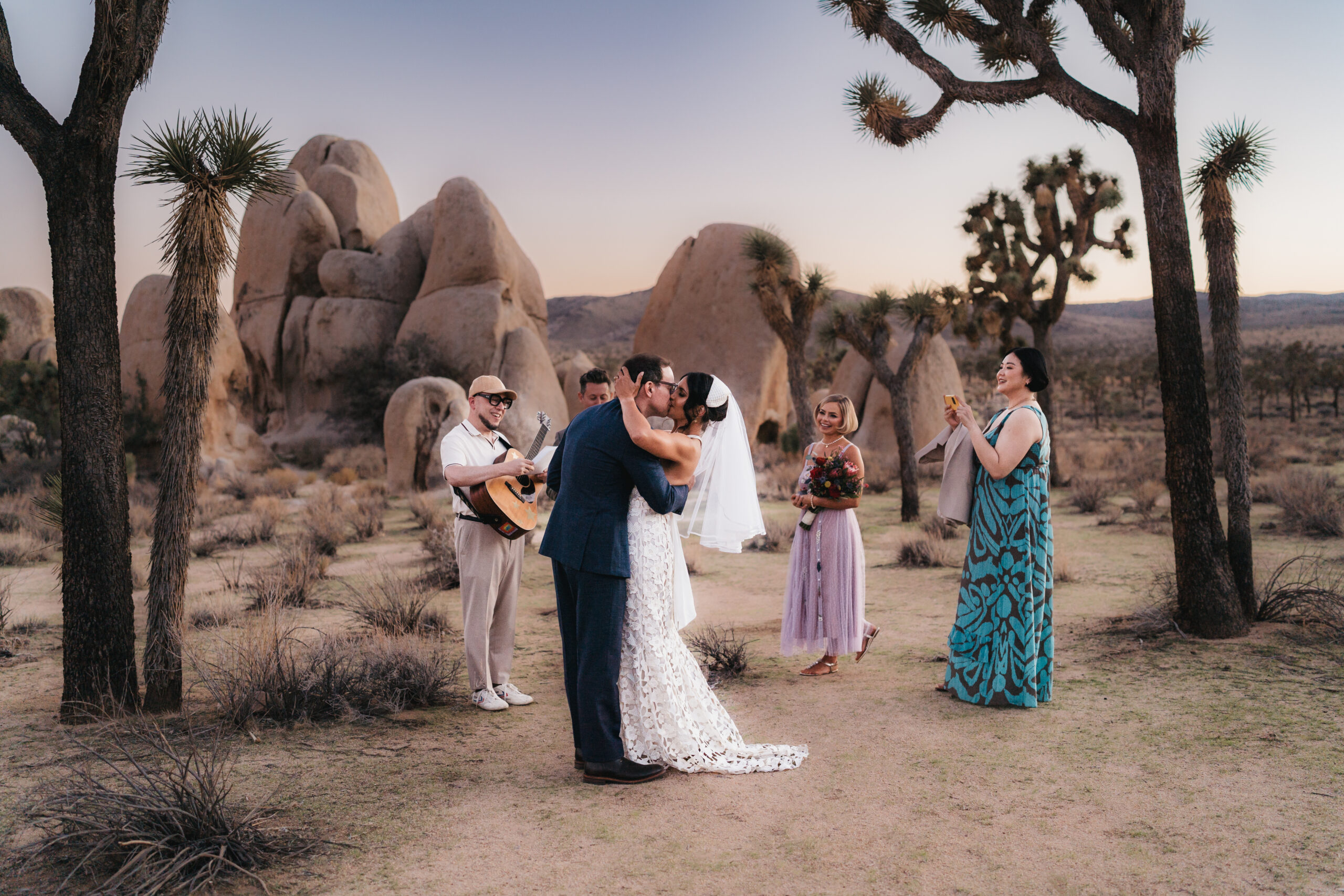First kiss as husband and wife during a Joshua Tree elopement.
