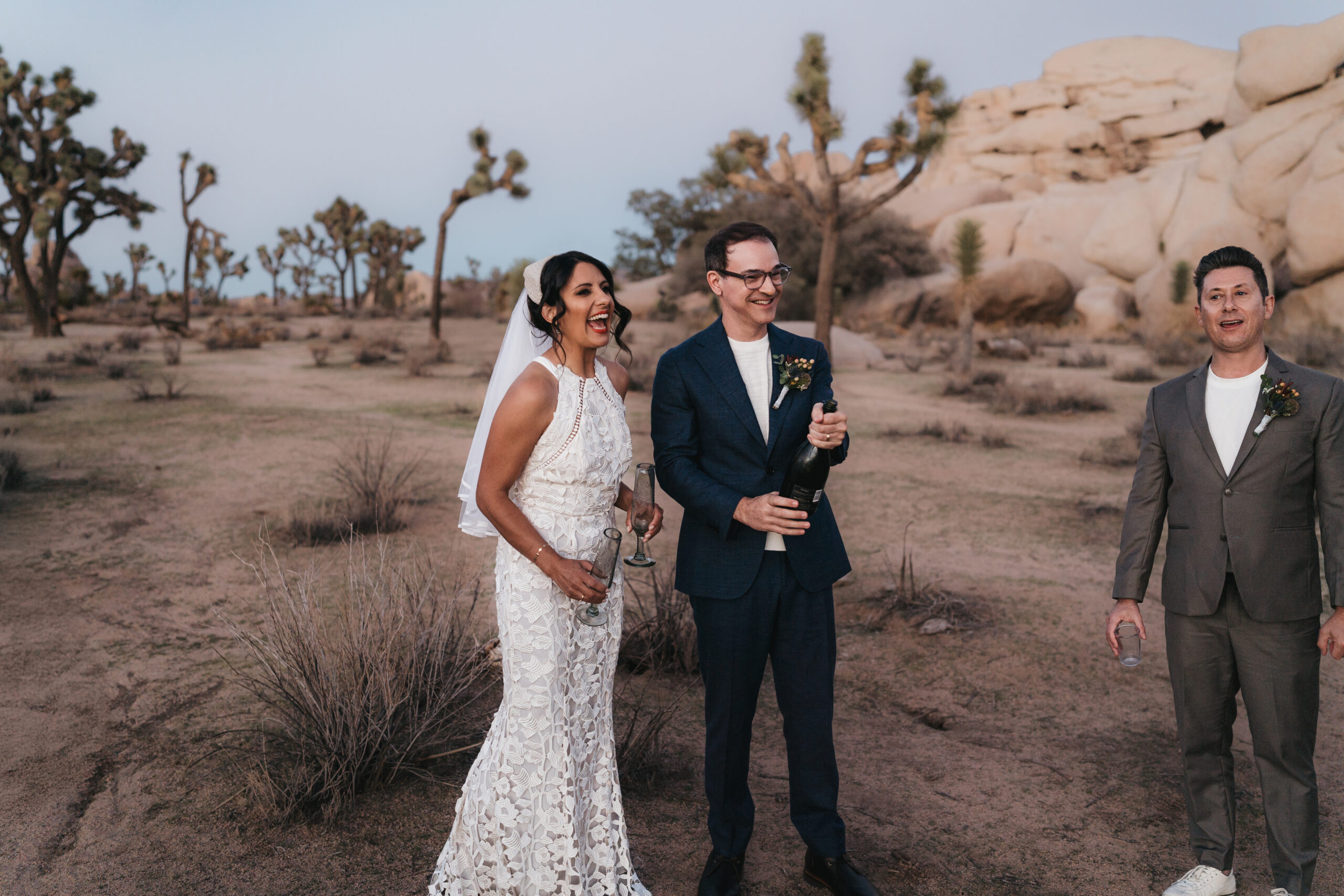 Couple sharing a glass of champagne during their ceremony.