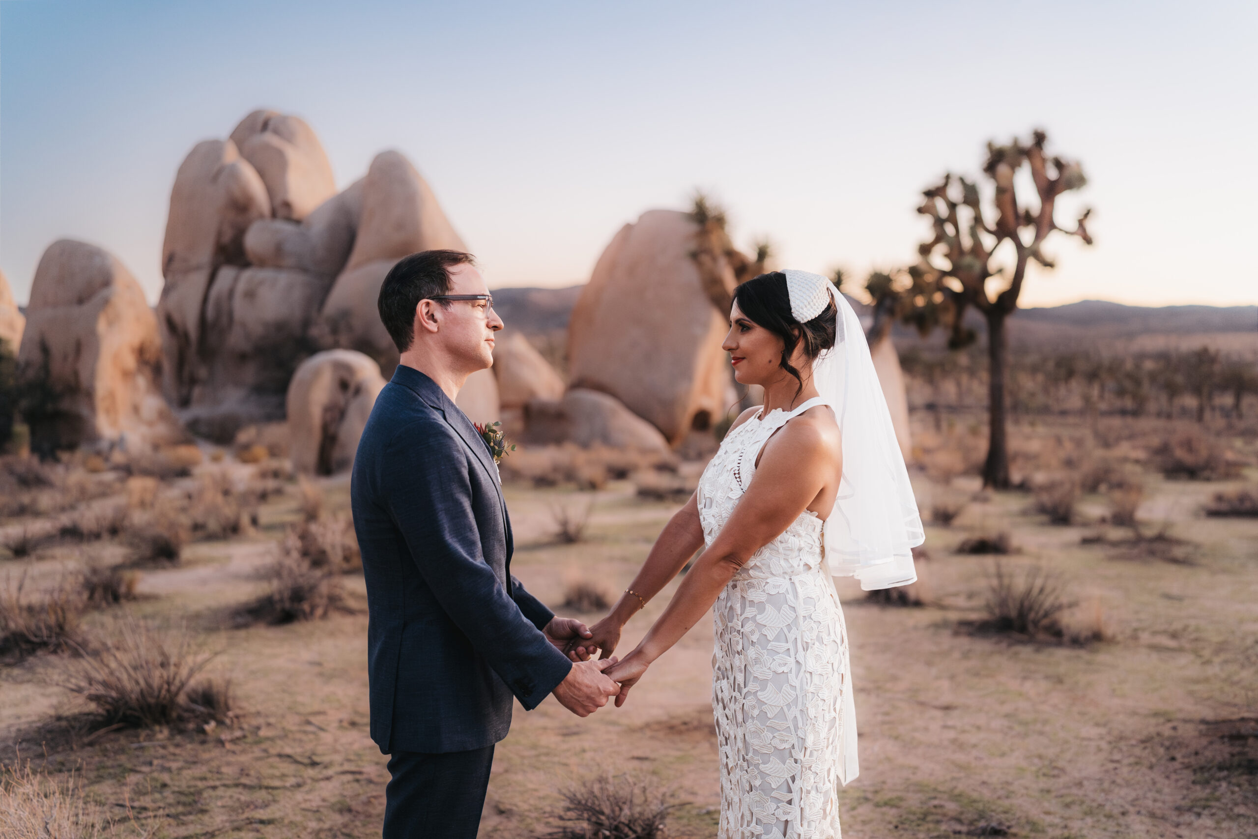 Newlyweds celebrating their Joshua Tree elopement in the California desert.