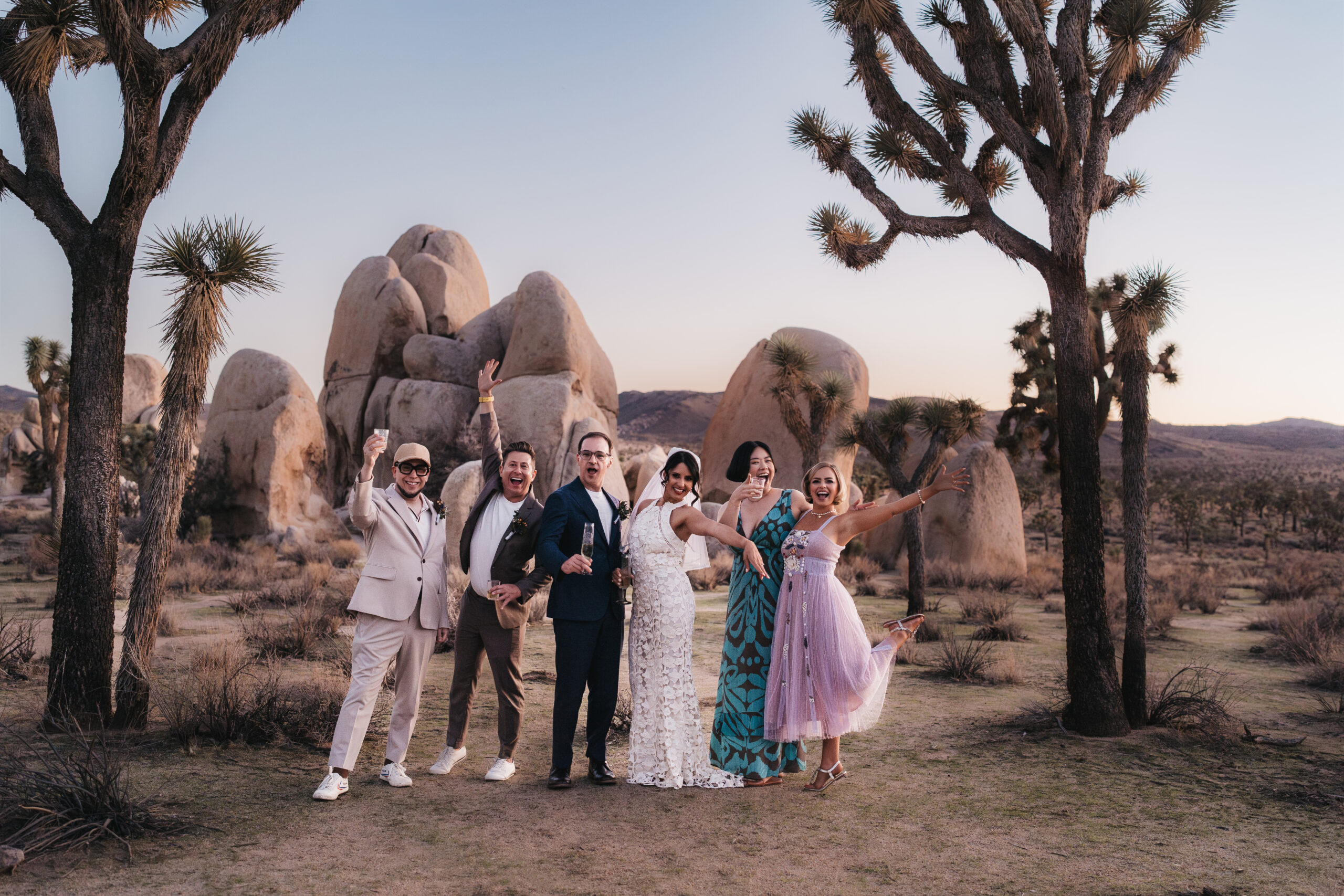 Couple celebrating with loved ones after their Joshua Tree elopement.