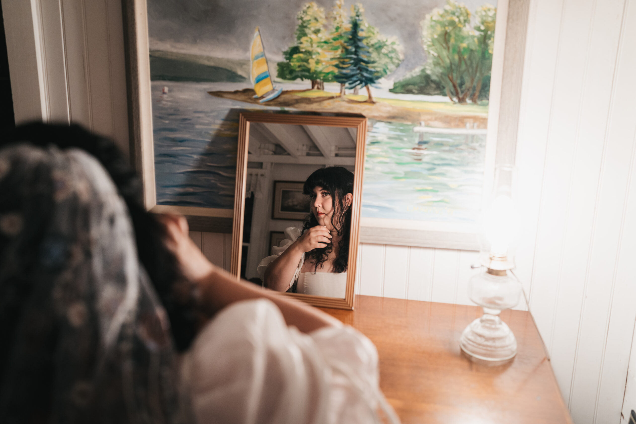 Bride getting ready for her sunrise Watkins Glen elopement on Seneca Lake.