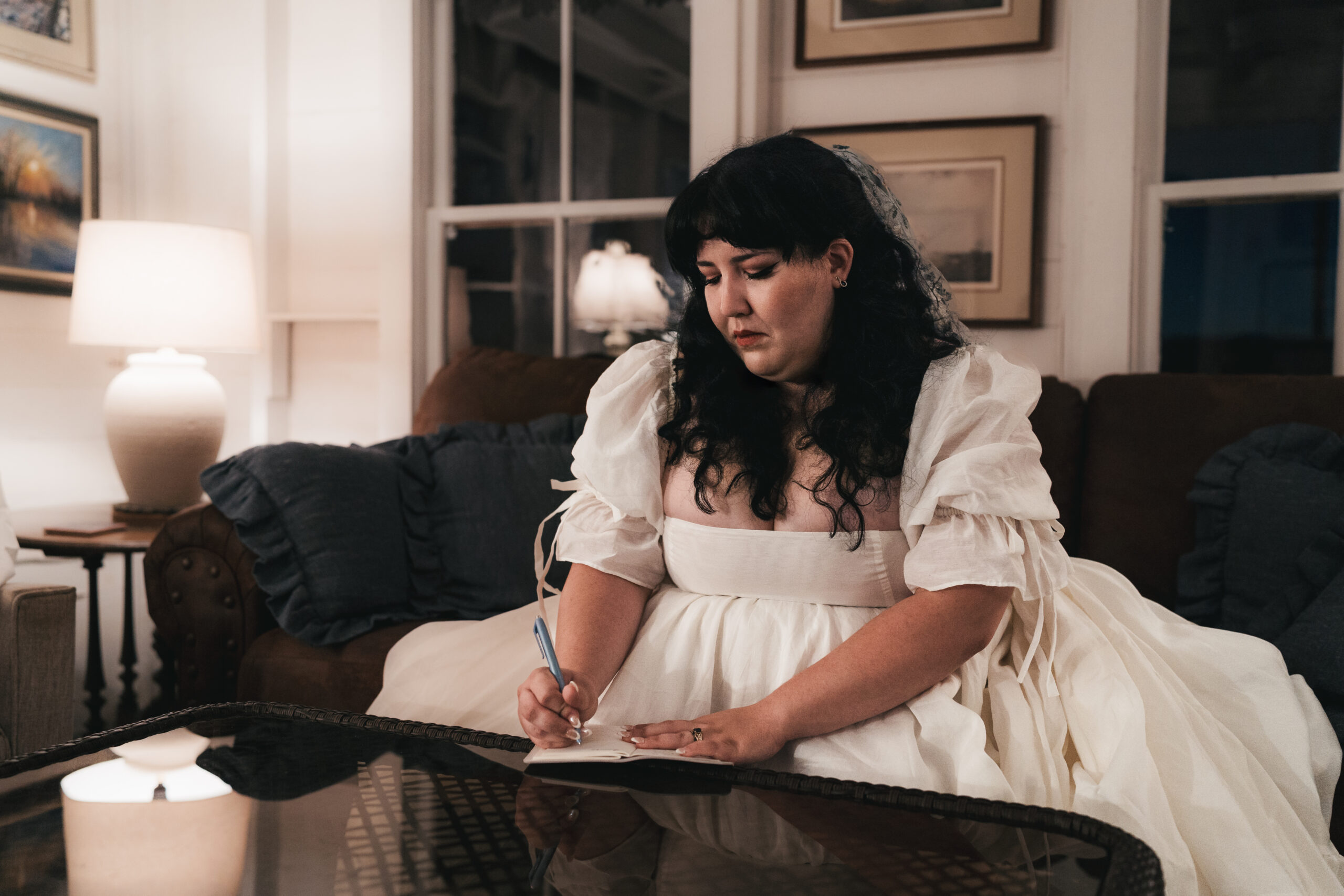 Bride writing vows before her romantic Watkins Glen elopement.