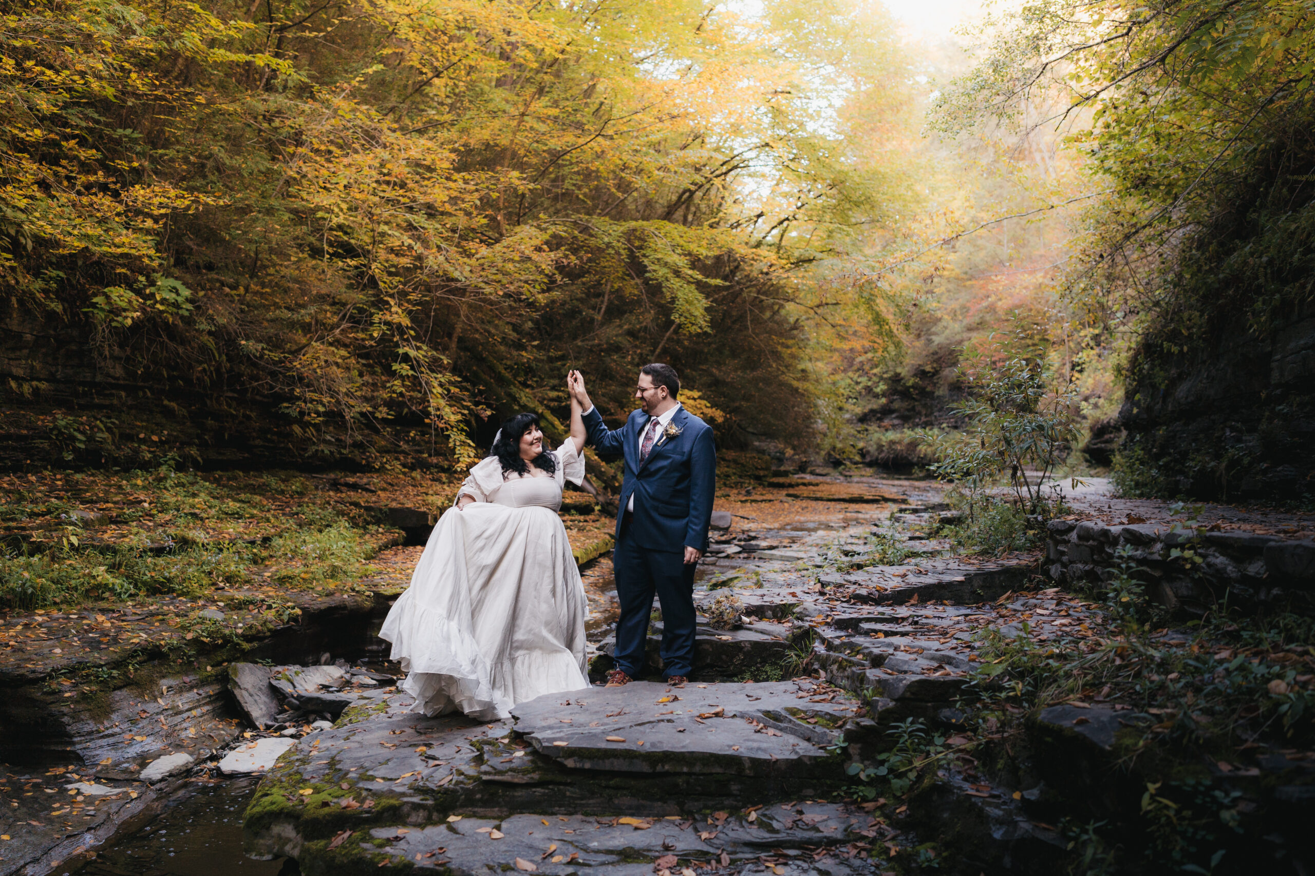 Fairytale wedding portraits at Watkins Glen State Park during a Watkins Glen elopement.