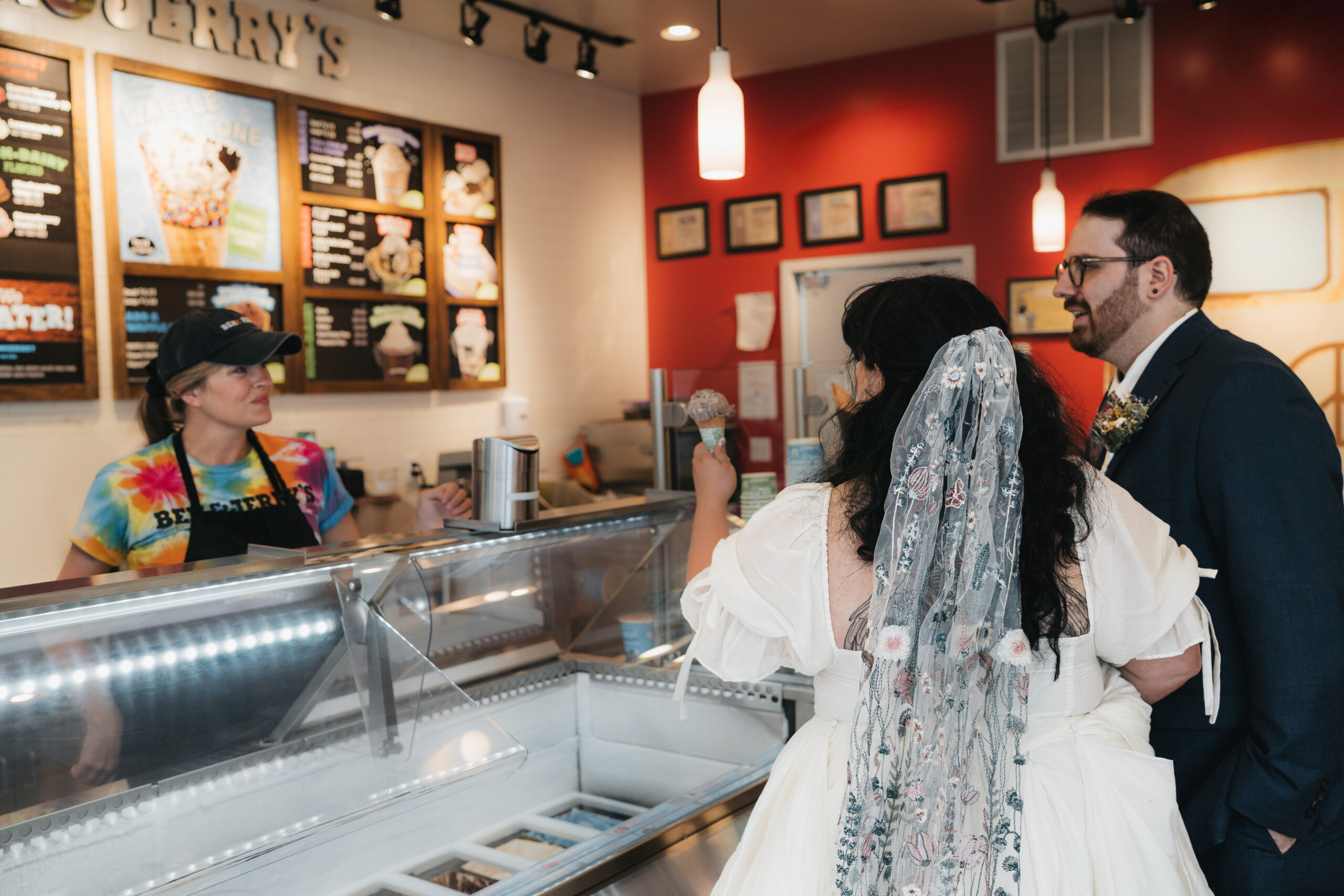 Couple celebrating with ice cream after their sunrise Watkins Glen elopement.
