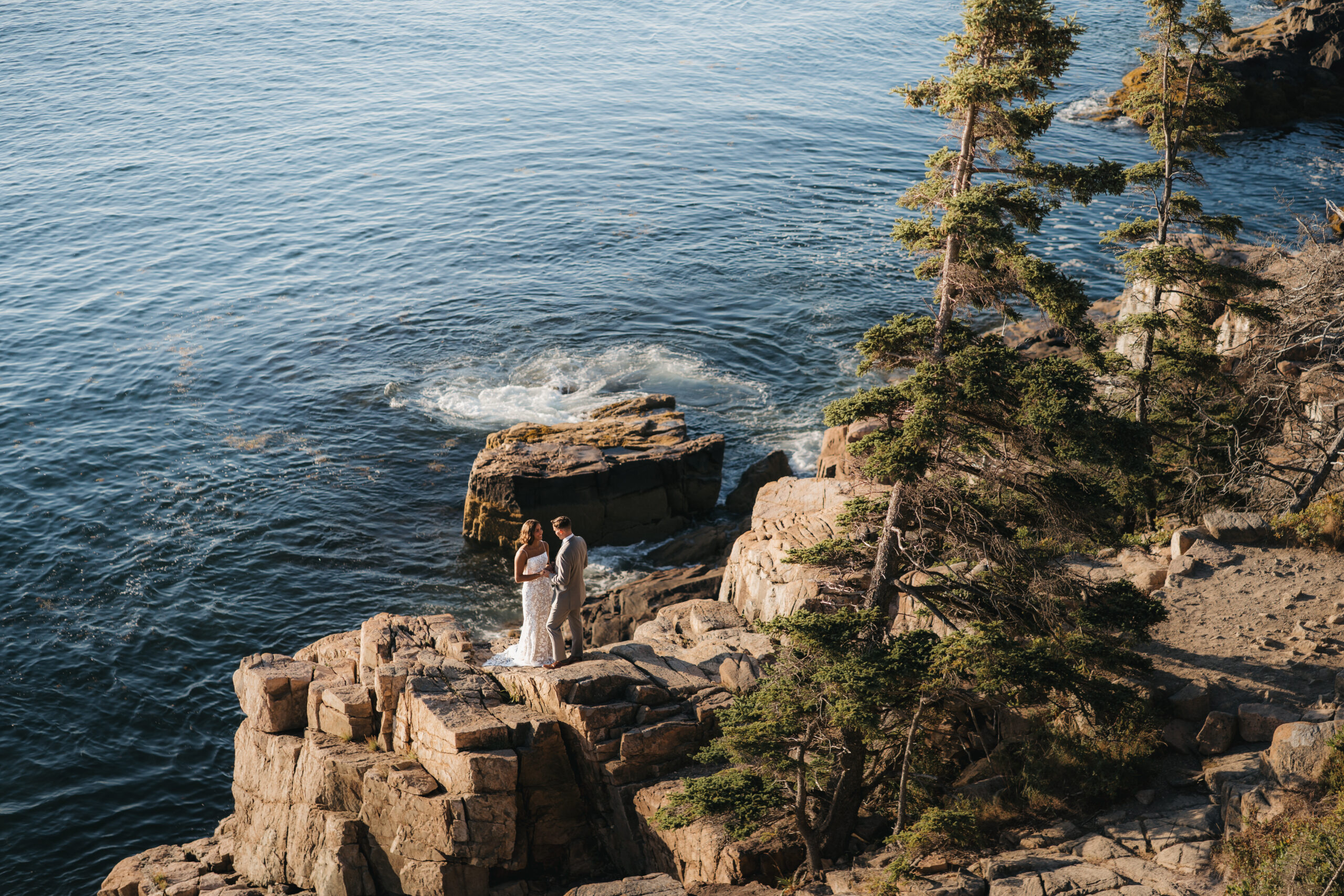 Bride and Groom embracing each other during their first look at Otter Cliffs.