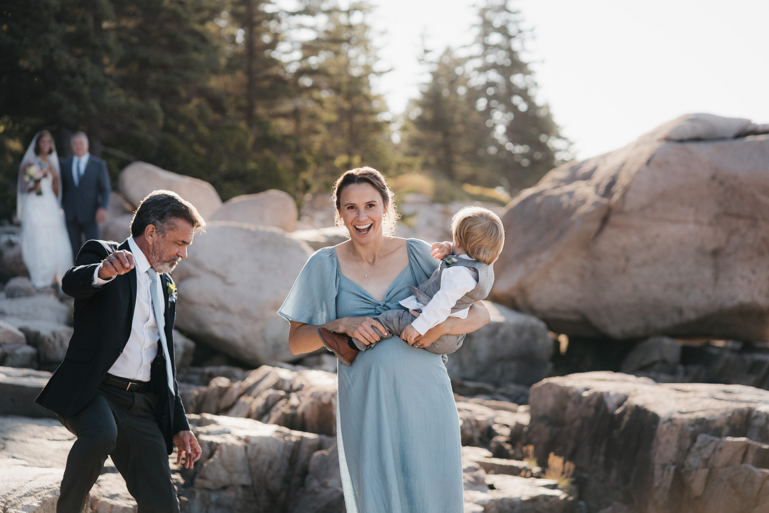 Family walking down the aisle during Acadia ceremony.