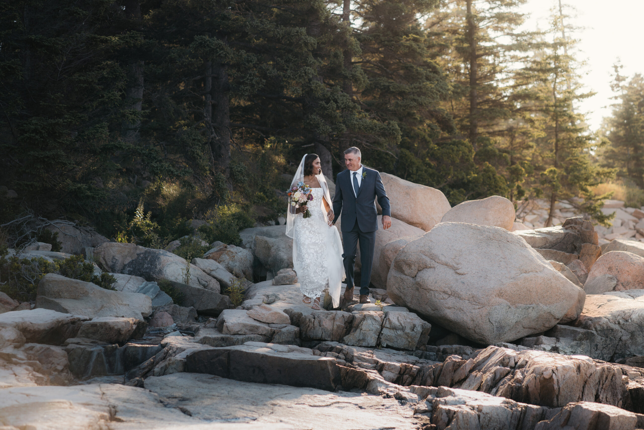 Father walking his daughter down the aisle for their Acadia ceremony.
