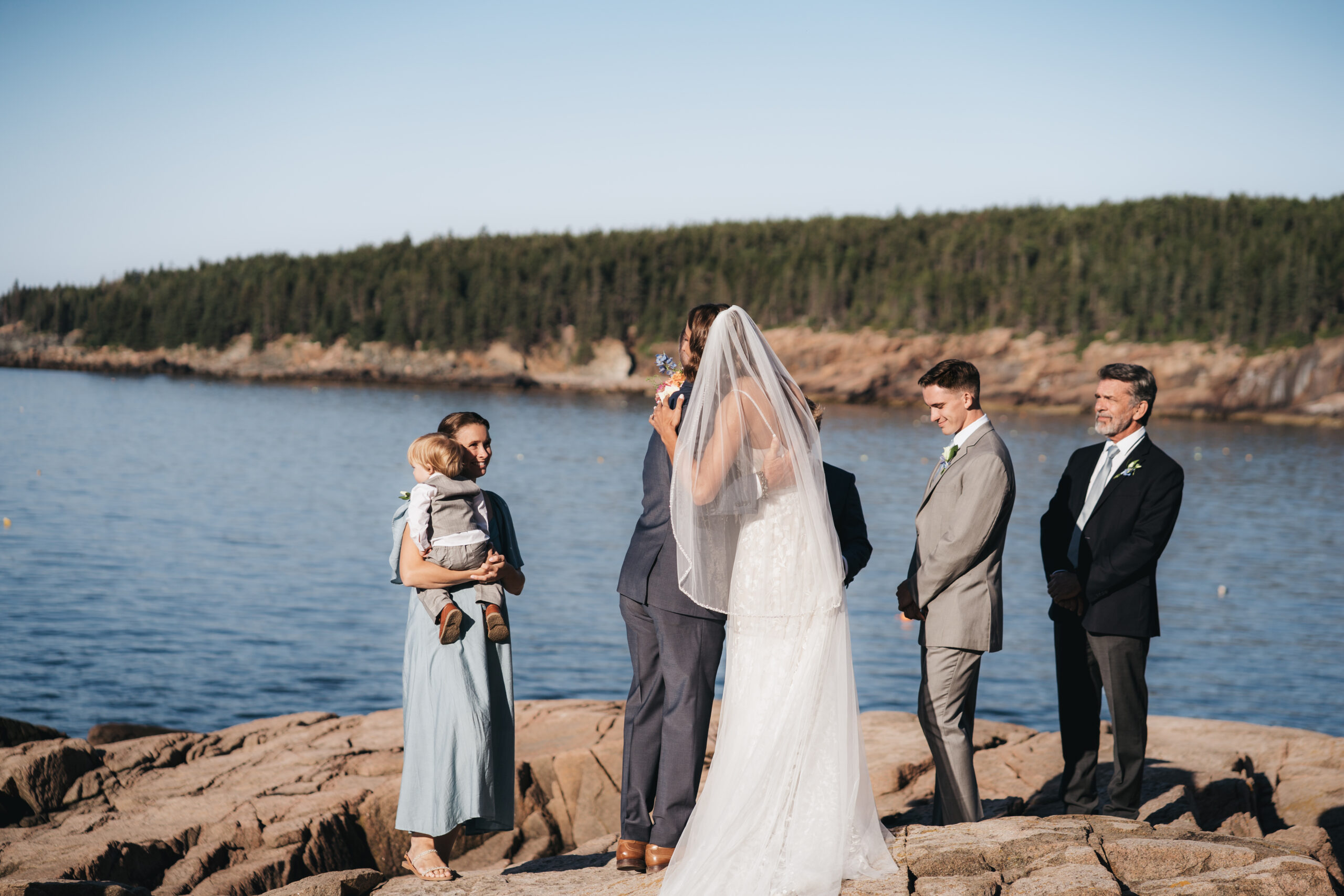 Oceanfront ceremony during a Sunrise Acadia Elopement in Acadia National Park.