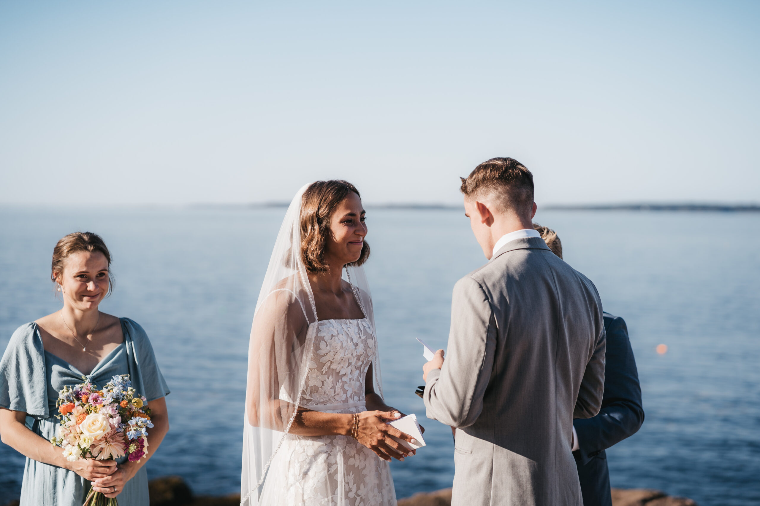 Emotional wedding ceremony overlooking the Atlantic during a Sunrise Acadia Elopement.