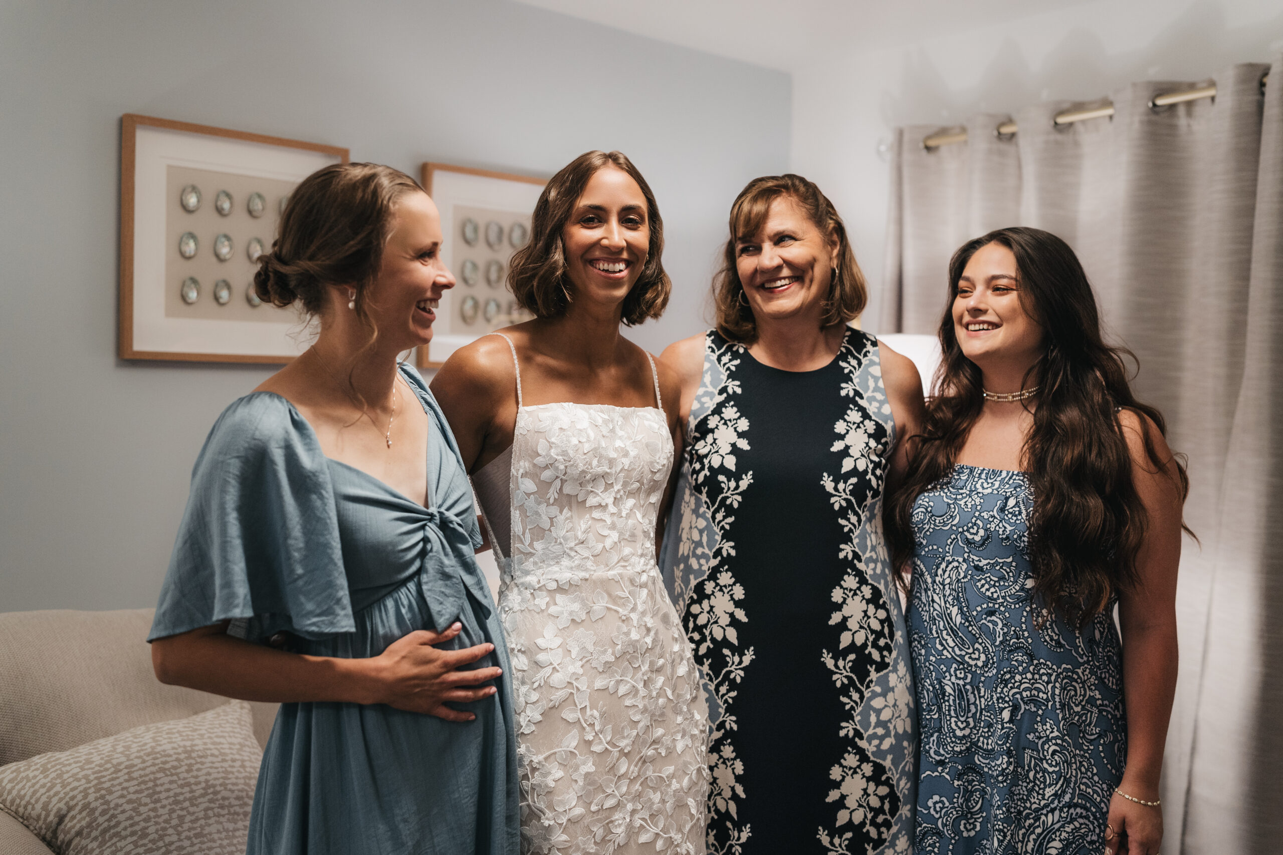 Bride getting ready for her Sunrise Acadia Elopement with bridesmaids at an Airbnb in Maine.