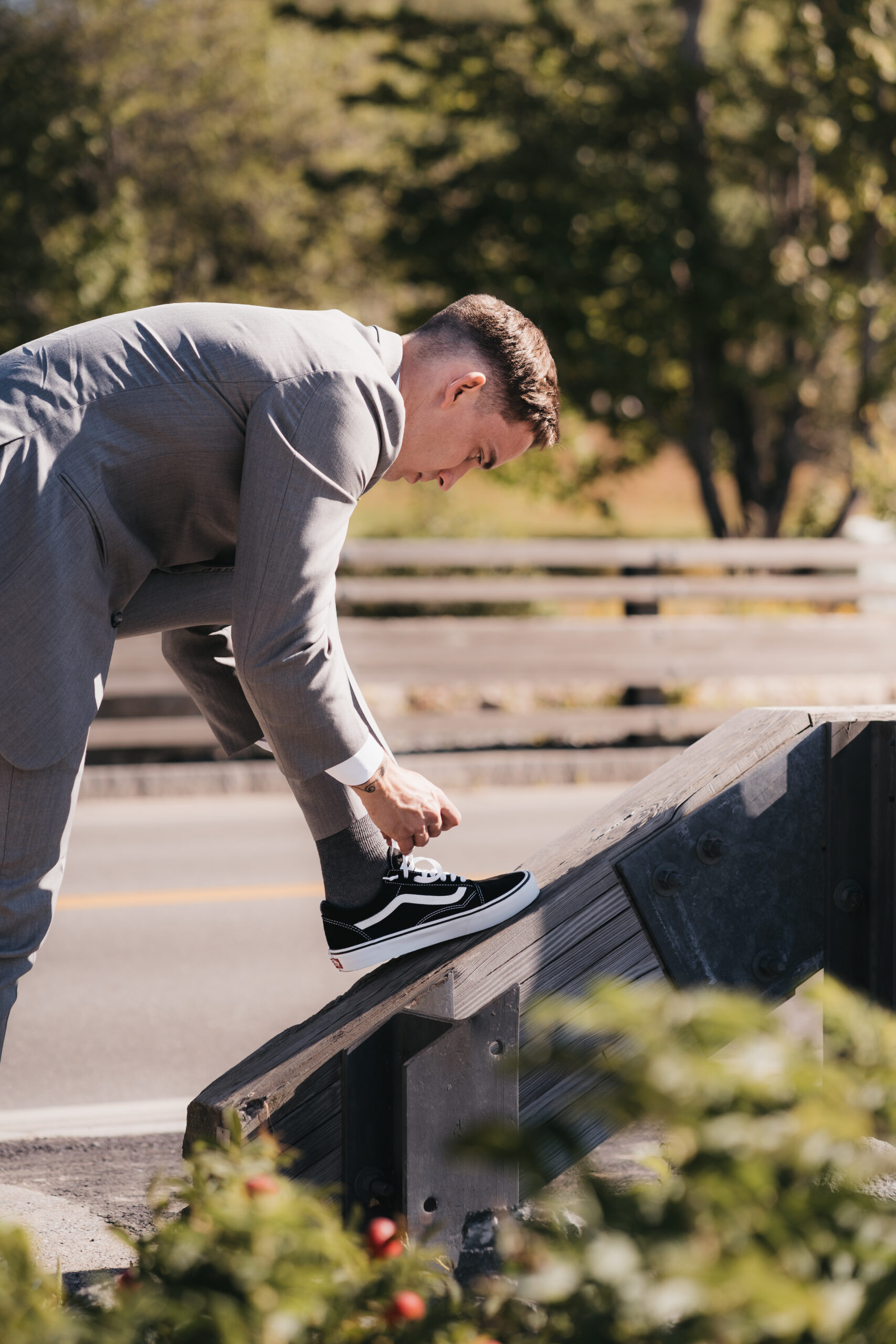 Groom putting on Vans after their ceremony.