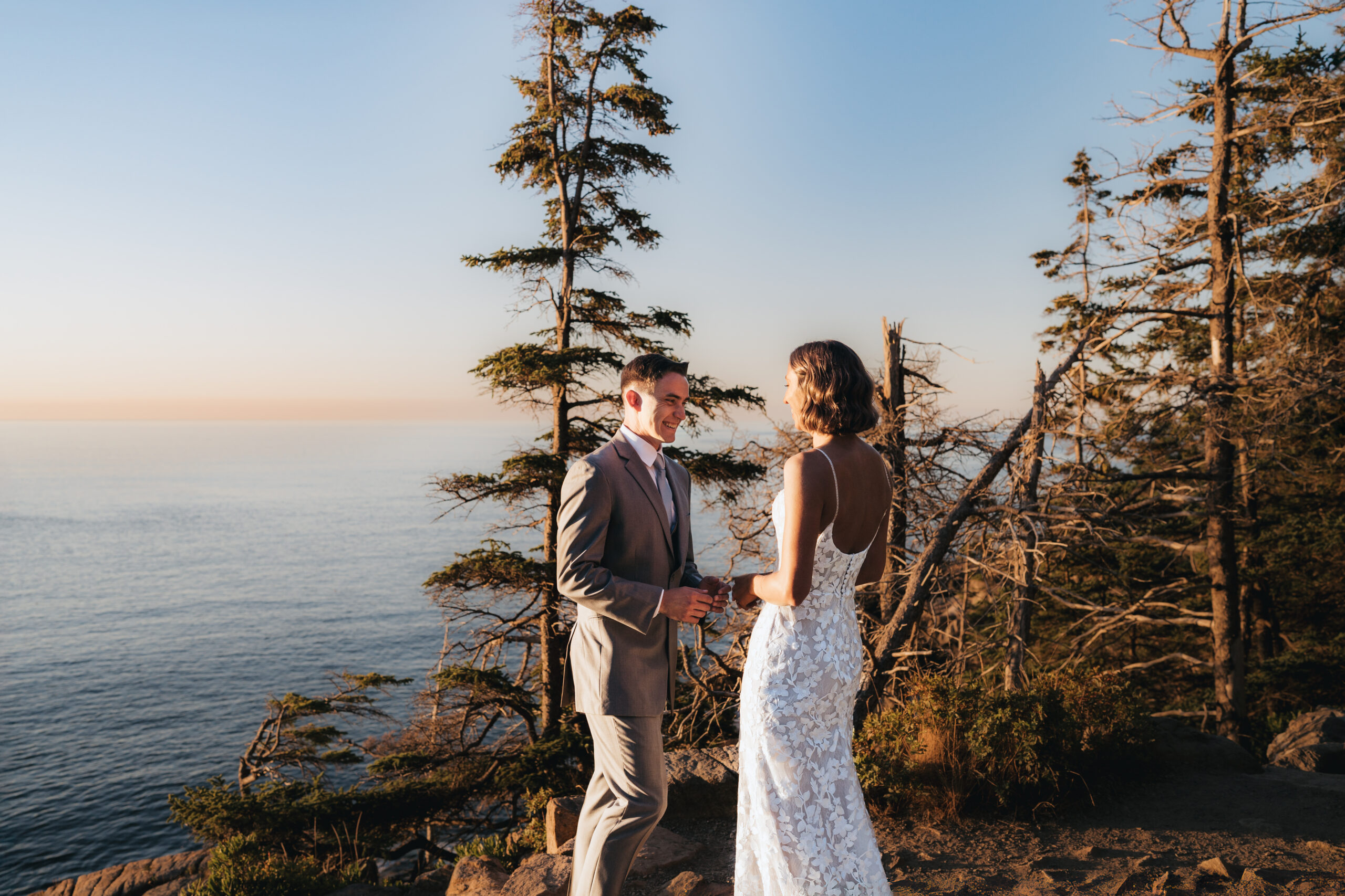 Bride and groom sharing a first look at Otter Cliffs.