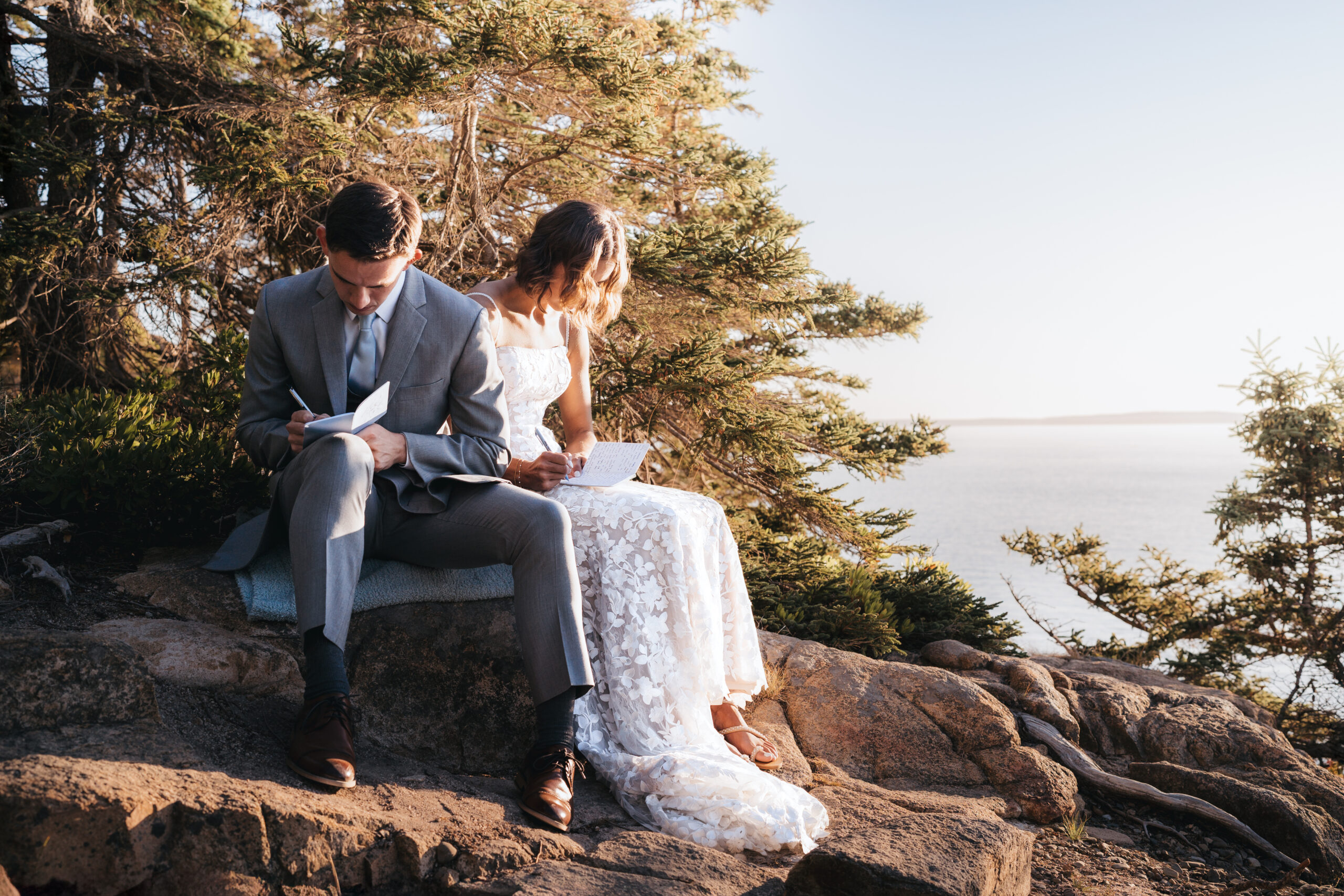 Intimate vow writing moment during a Sunrise Acadia Elopement at Otter Cliffs.